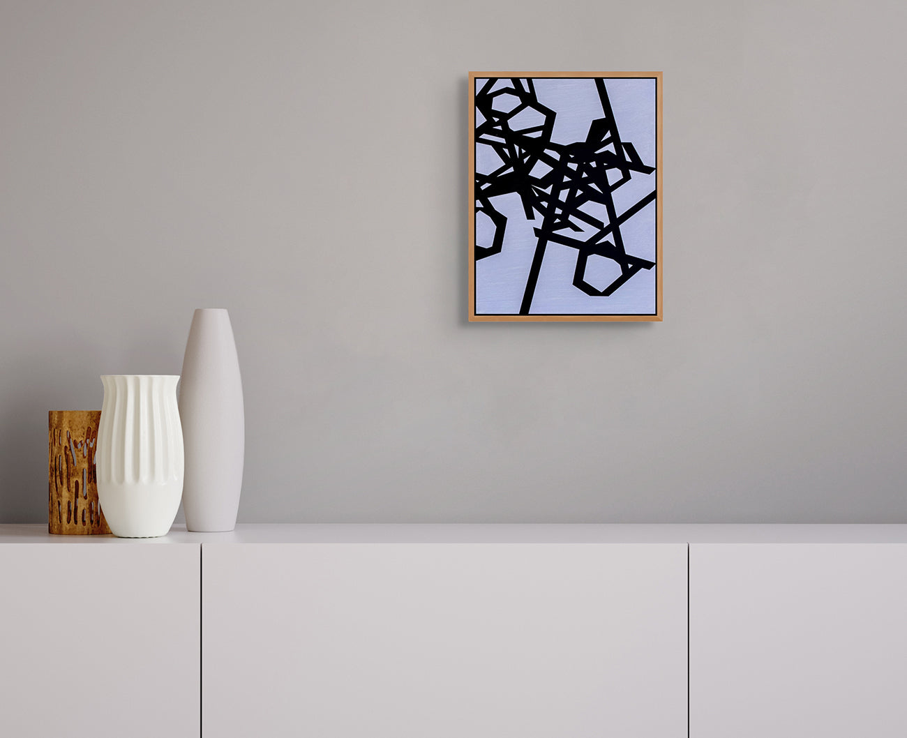 A black and white abstract painting on a blue background.