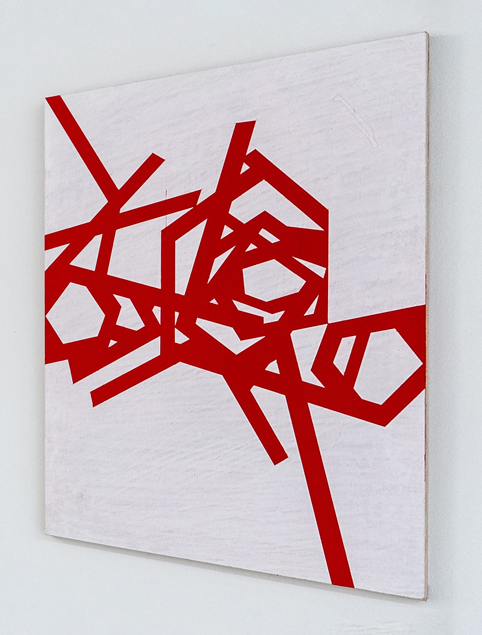 A red and white abstract painting on a white background.