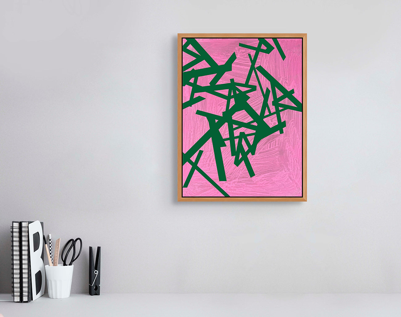 A pink and green abstract painting on a pink background.