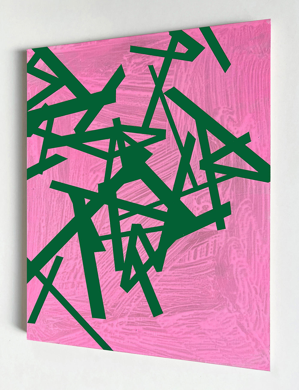 A pink and green abstract painting on a pink background.