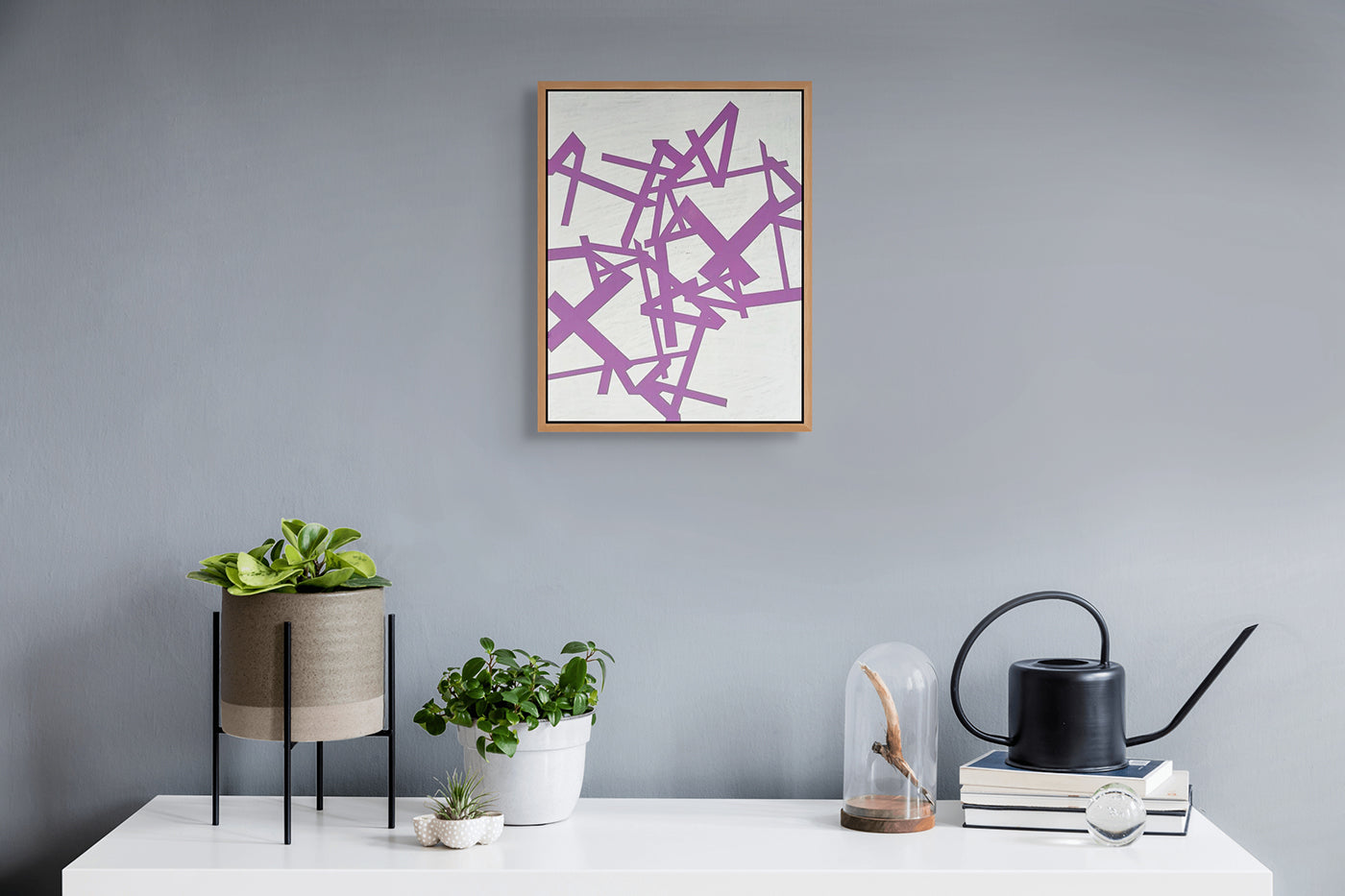 A painting of purple and white geometric shapes on a white background.