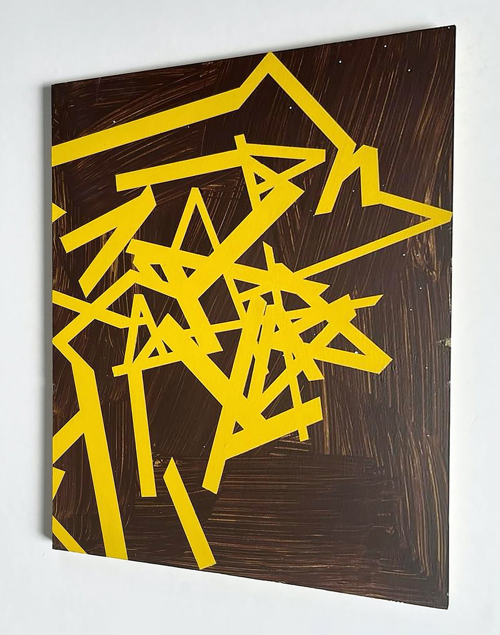 A painting of yellow and brown shapes on a brown background.