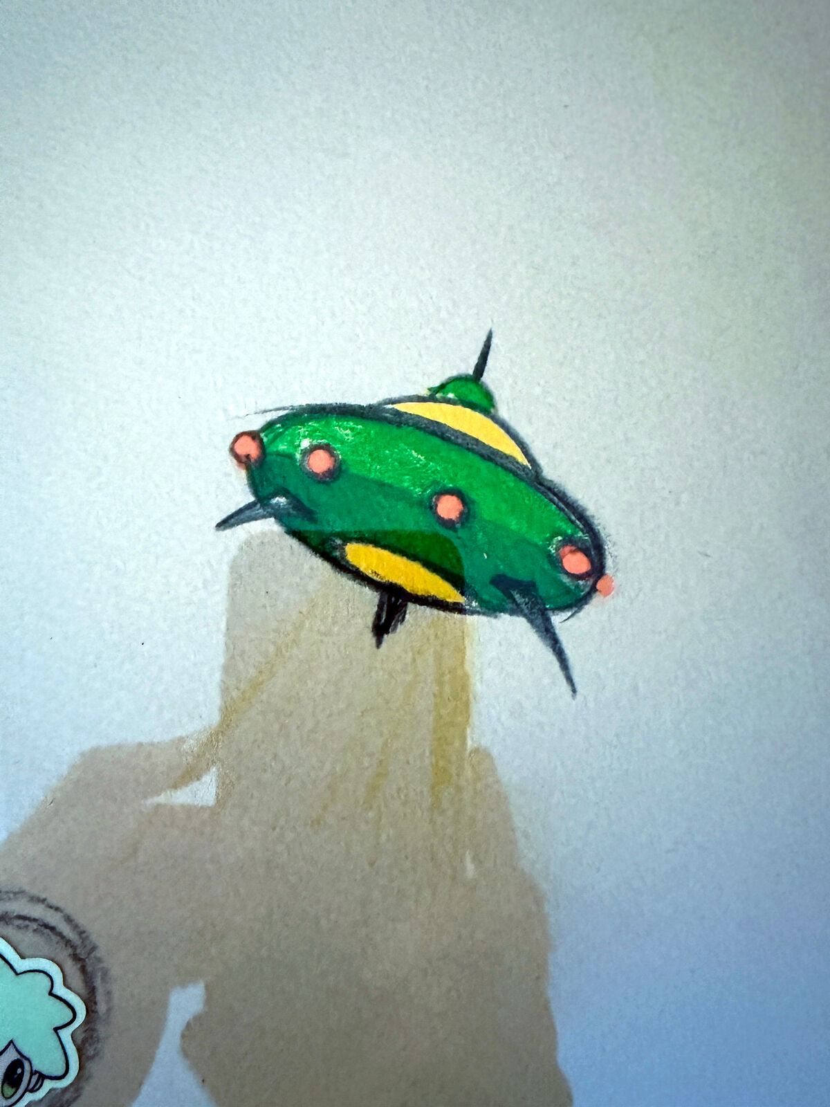 A framed drawing of a group of people in a room.