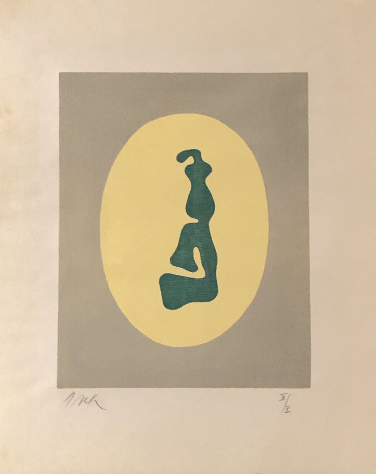 A blue and yellow print of a woman sitting in a circle.