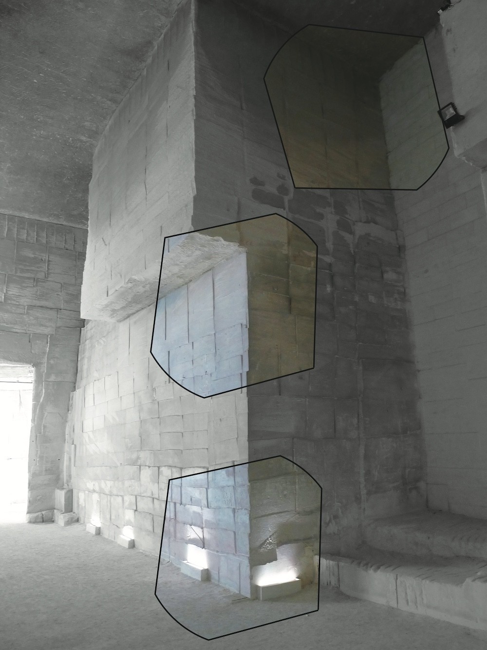 A raw architectural interior with exposed concrete walls and geometric outlines highlighting structural elements.
