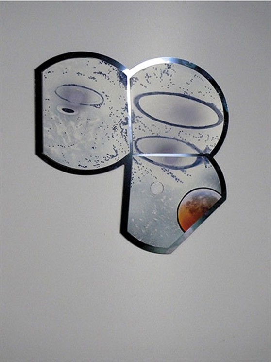 A metallic, abstract sculpture featuring three curved panels with celestial imagery.