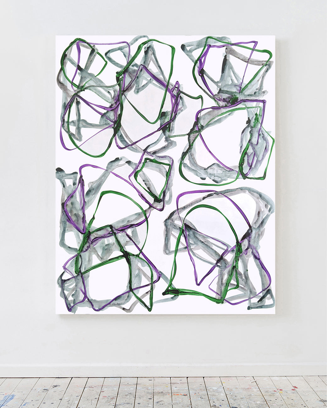 A drawing of purple and green shapes on a white background.