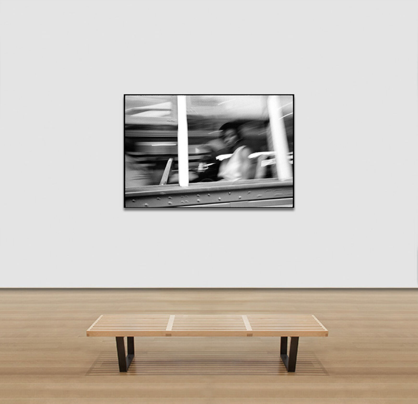 A black and white photo of people riding a bus.