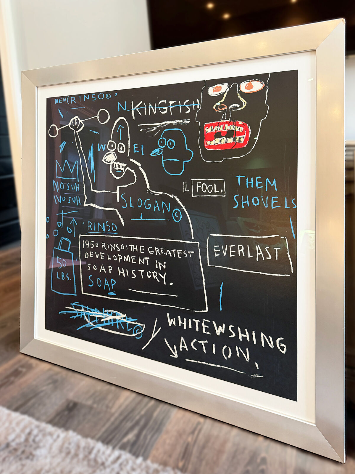 A blackboard with a drawing of a man holding a hammer.