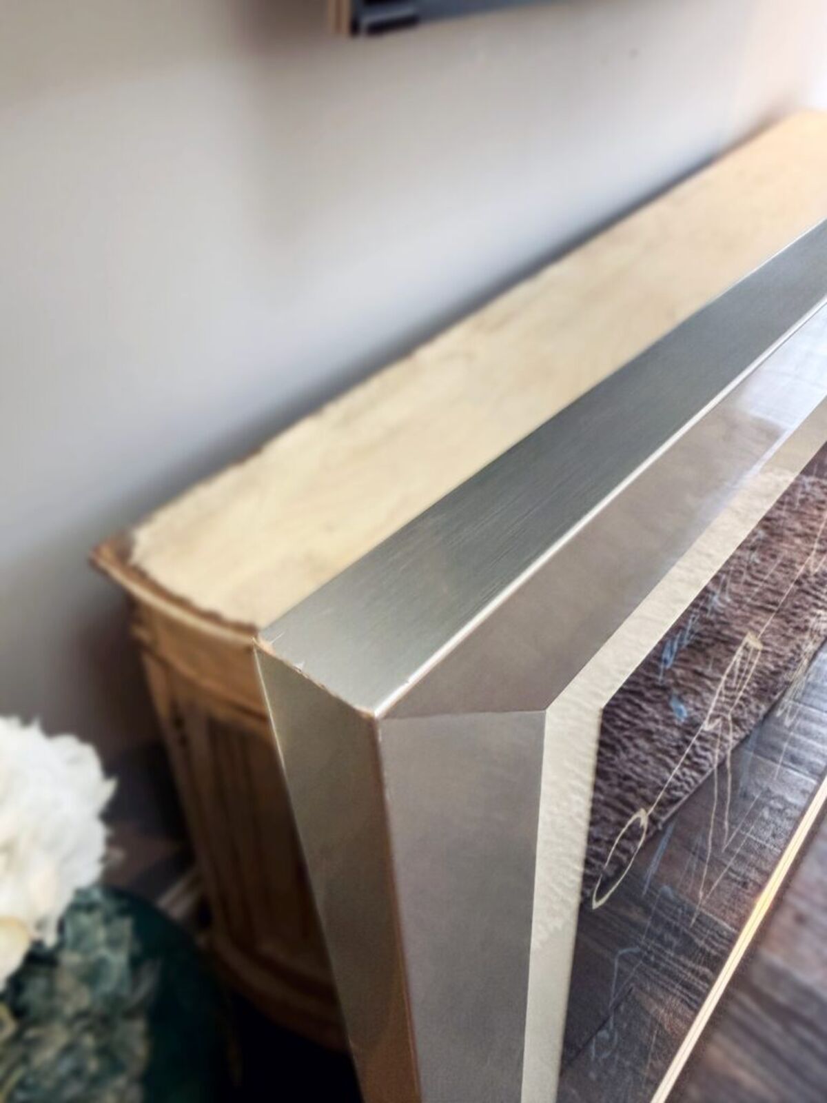 A blackboard with a drawing of a man holding a hammer.