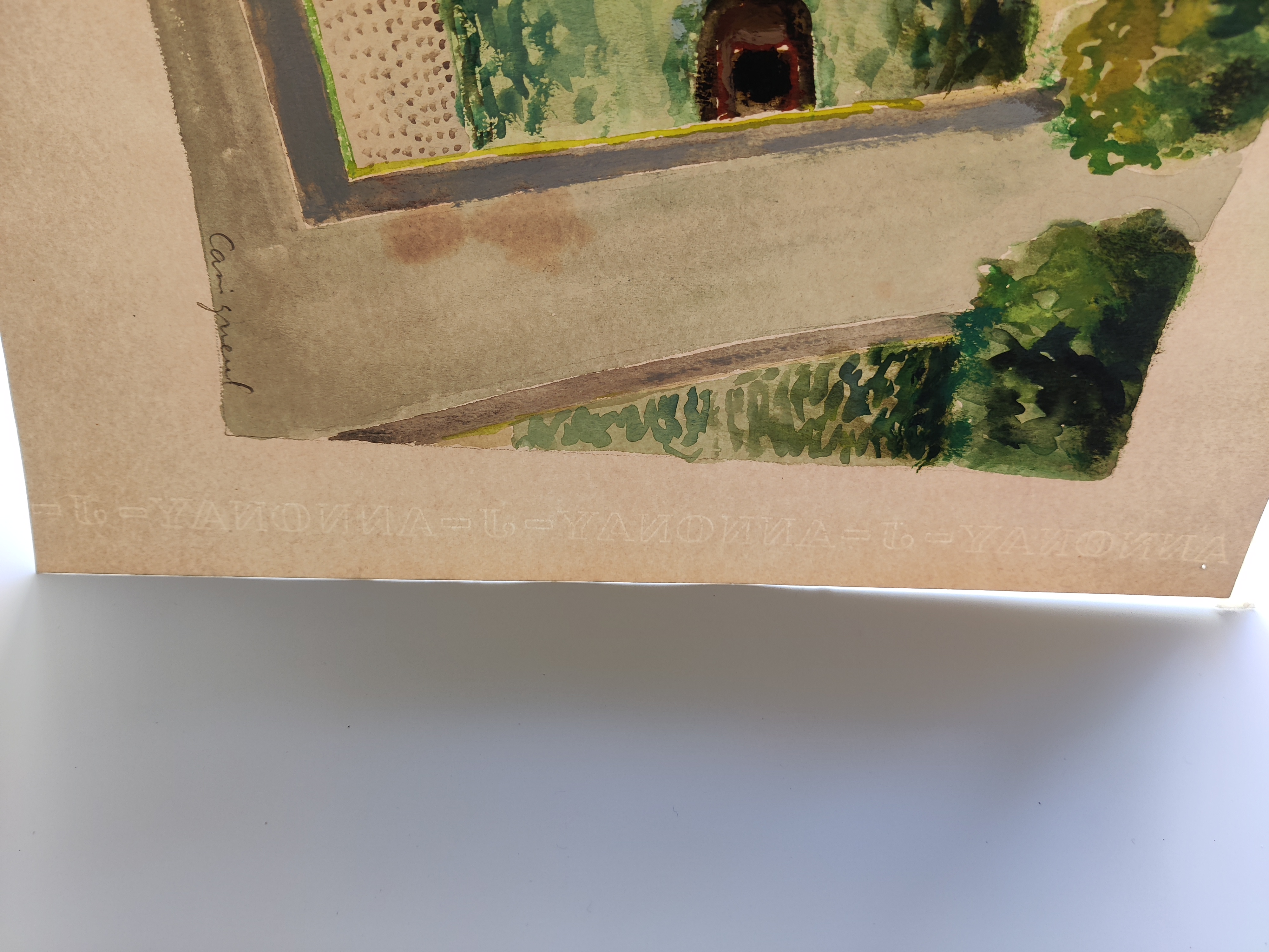 A painting hanging on a wall in a black frame.