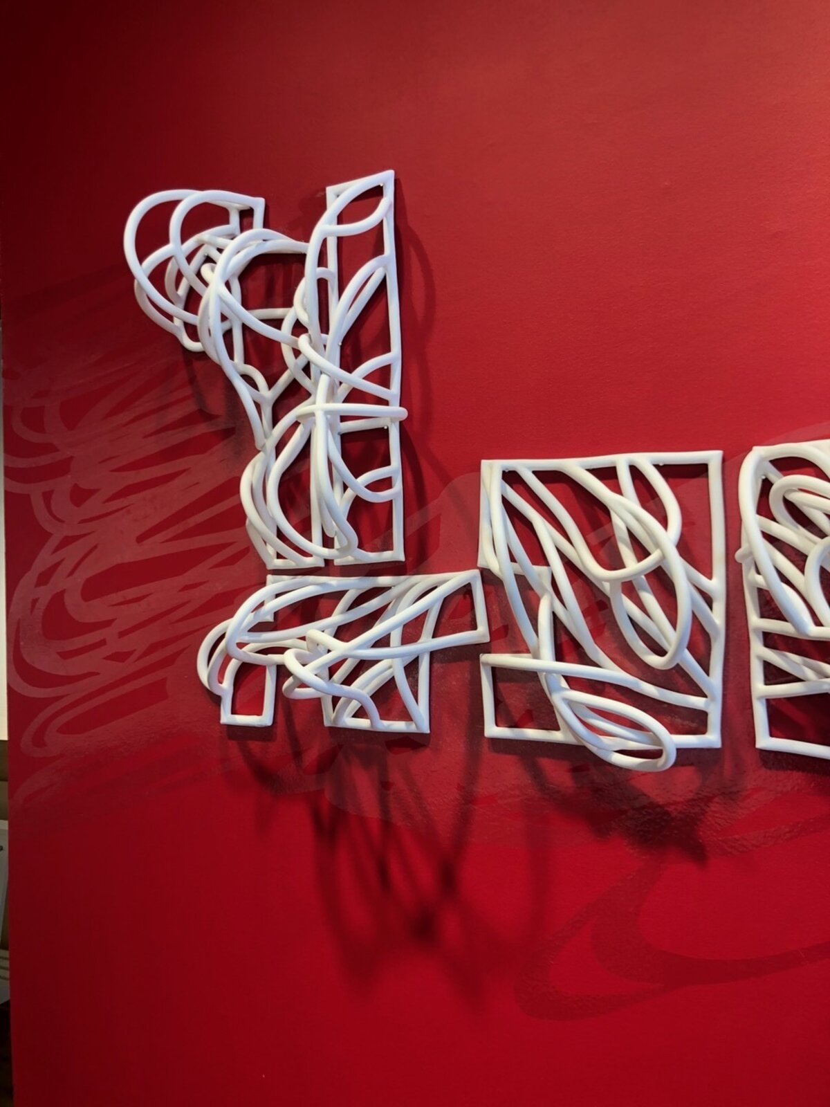 Artwork by Jeanne Quinn, Dust And A Shadow, Made of Porcelain, underglaze, vinyl, paint 