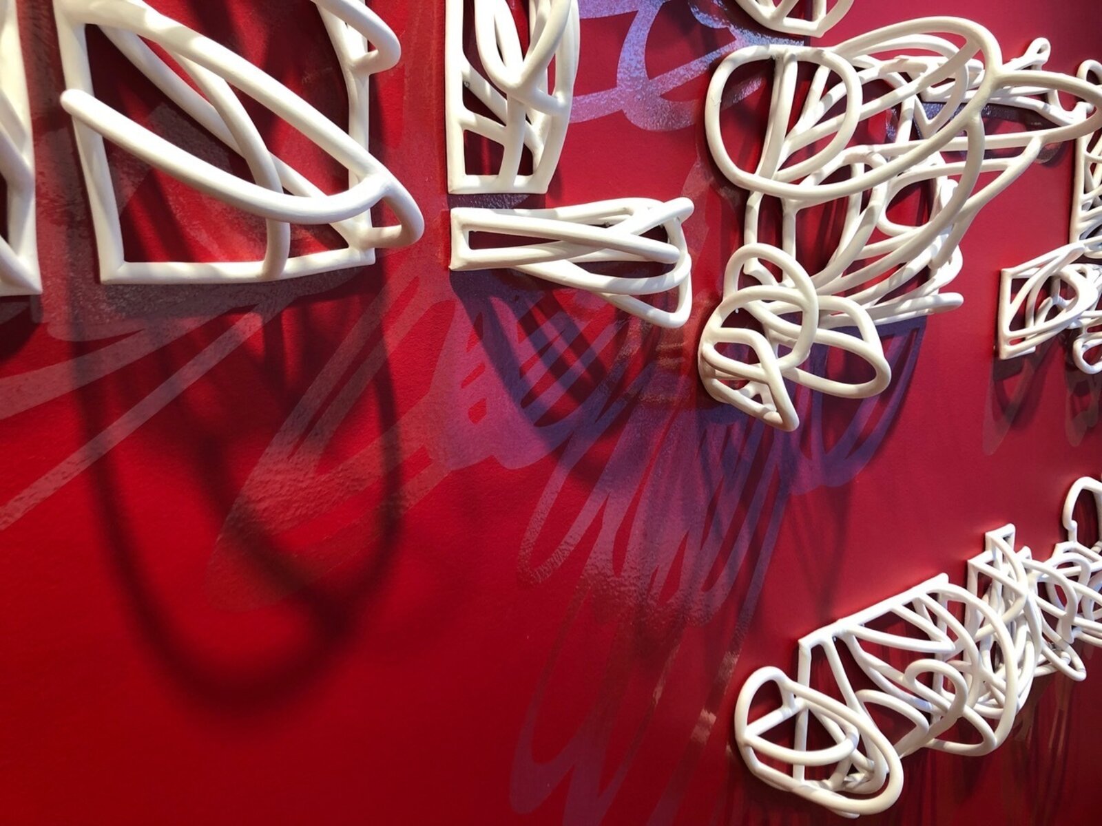 Artwork by Jeanne Quinn, Dust And A Shadow, Made of Porcelain, underglaze, vinyl, paint 