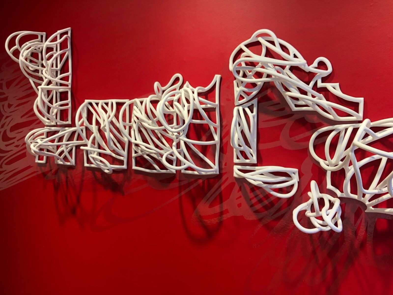 Artwork by Jeanne Quinn, Dust And A Shadow, Made of Porcelain, underglaze, vinyl, paint 