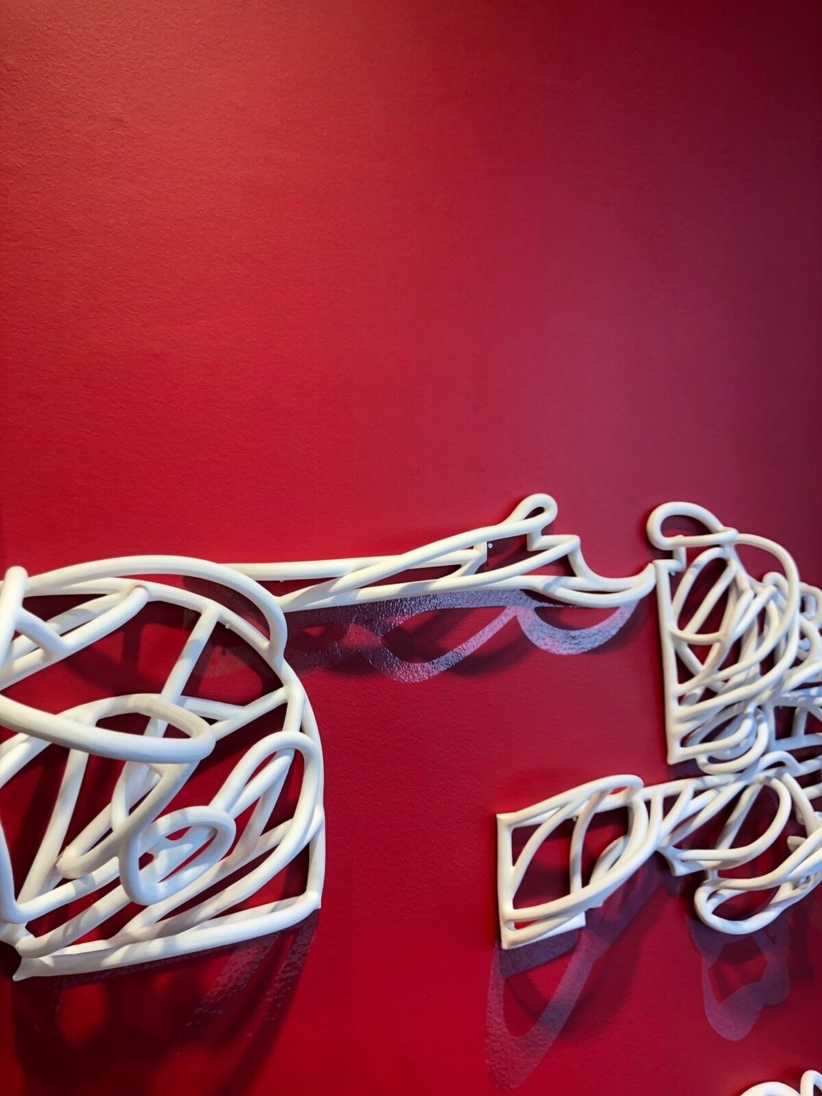 Artwork by Jeanne Quinn, Dust And A Shadow, Made of Porcelain, underglaze, vinyl, paint 