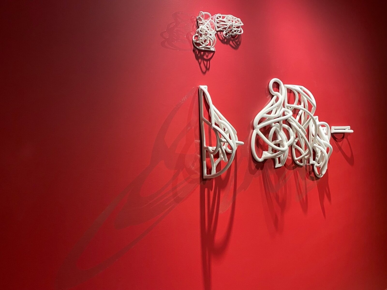 Artwork by Jeanne Quinn, Dust And A Shadow II, Made of Porcelain, underglaze, vinyl, paint 