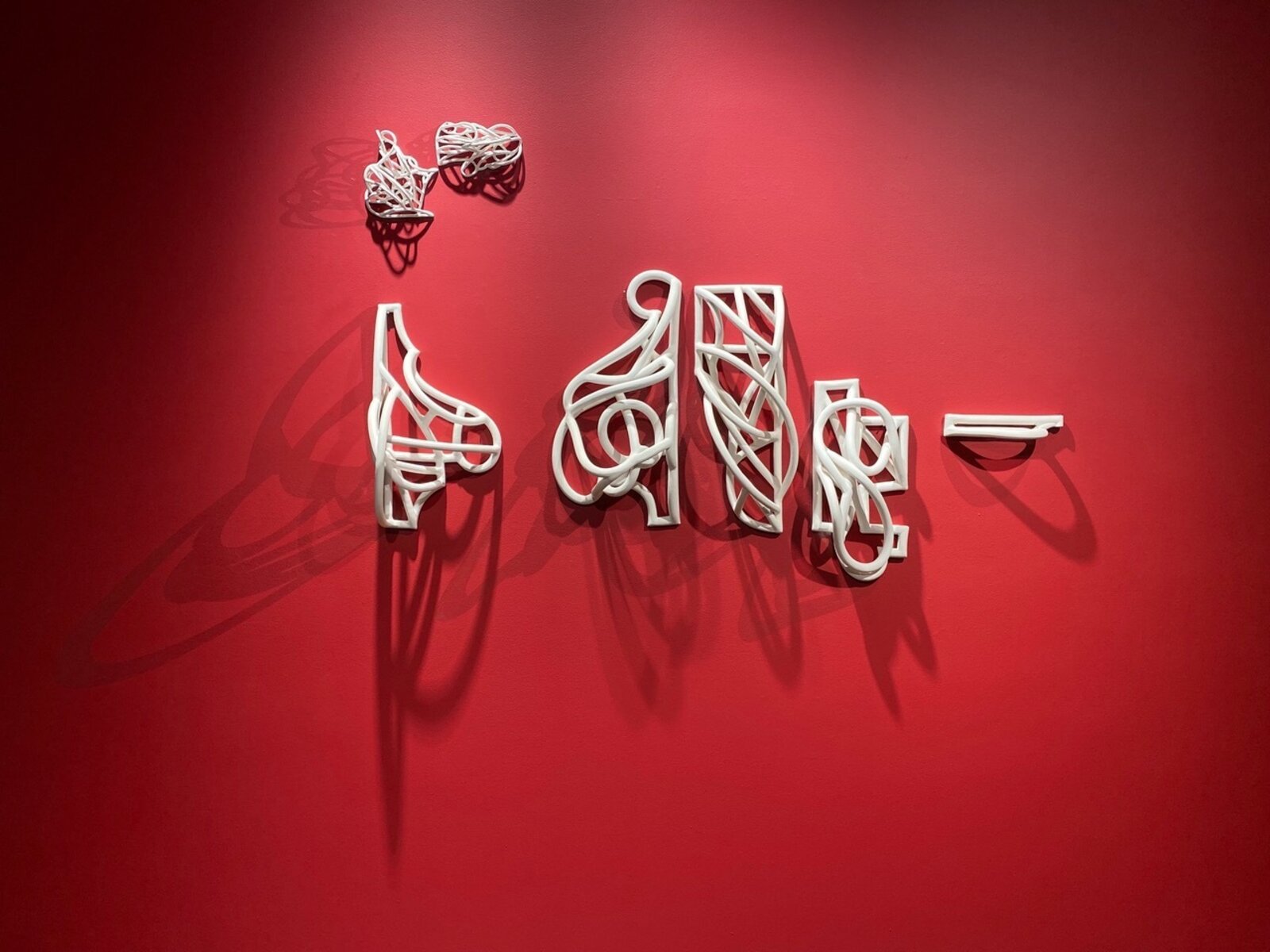 Artwork by Jeanne Quinn, Dust And A Shadow II, Made of Porcelain, underglaze, vinyl, paint 