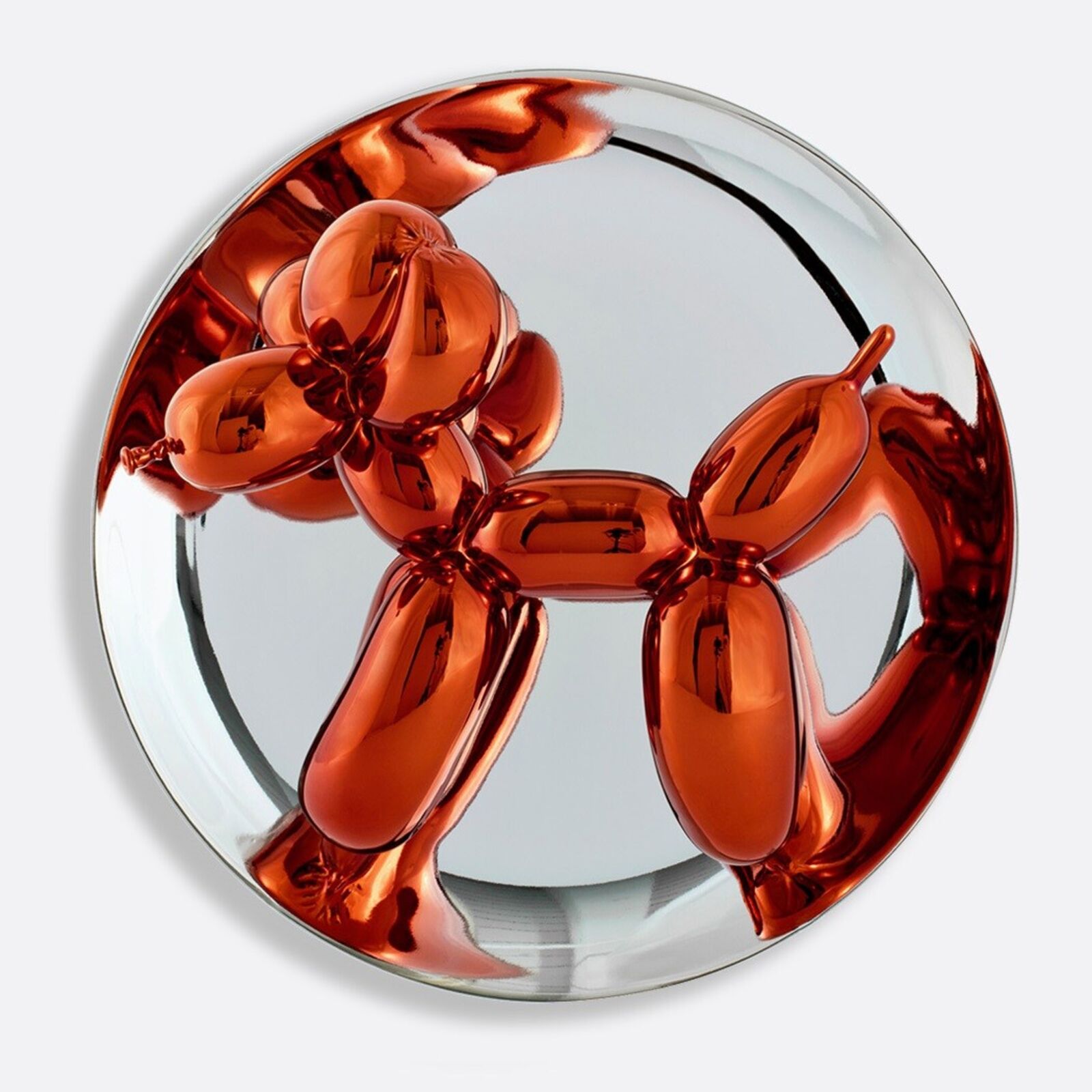 A trio of glossy, metallic balloon-dog sculptures displayed on clear stands against a neutral background.