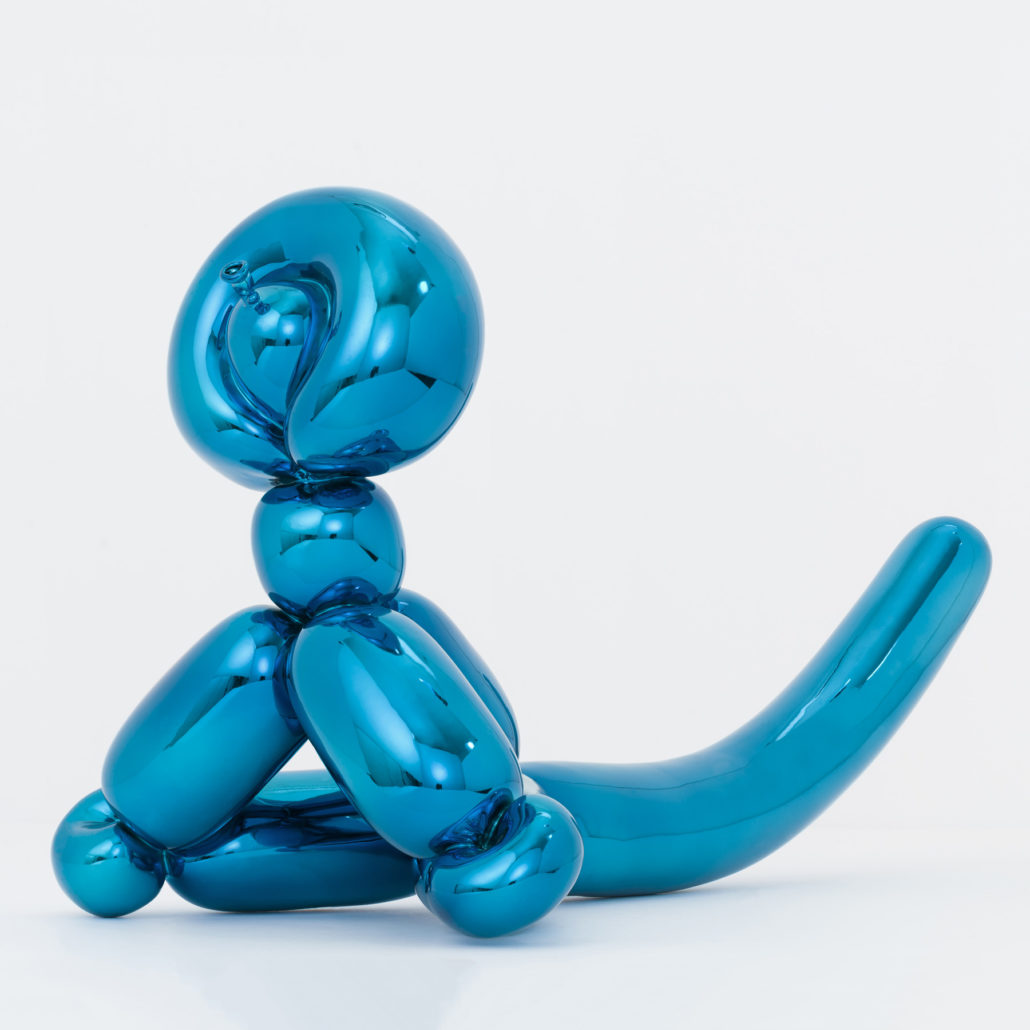 A blue balloon sculpture of a dog sitting on its hind legs.