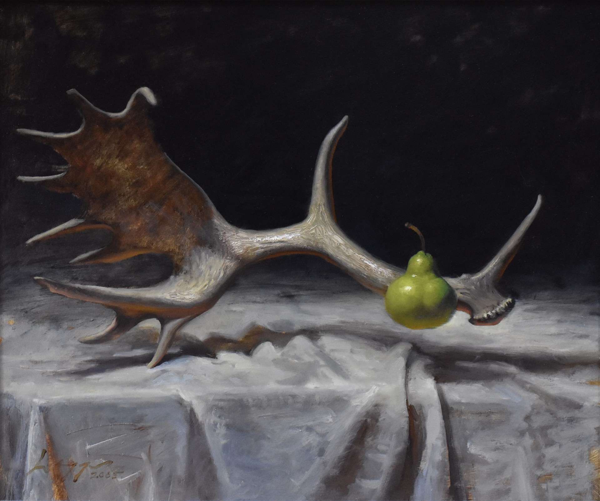 A surreal still life featuring a large deer antler resting on a draped cloth with a single green pear placed at its tip.
