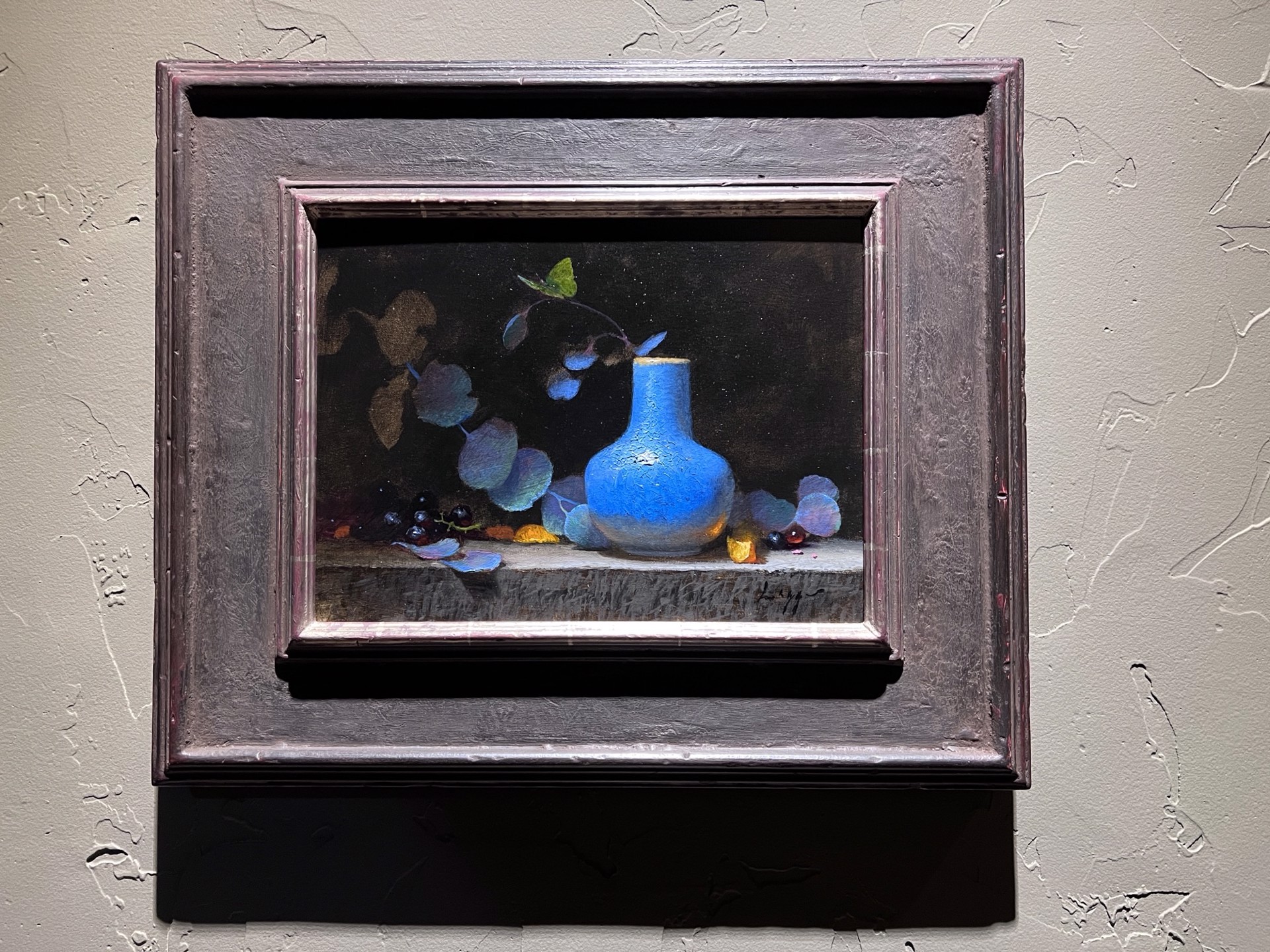 A painting of a blue vase sitting on a ledge.