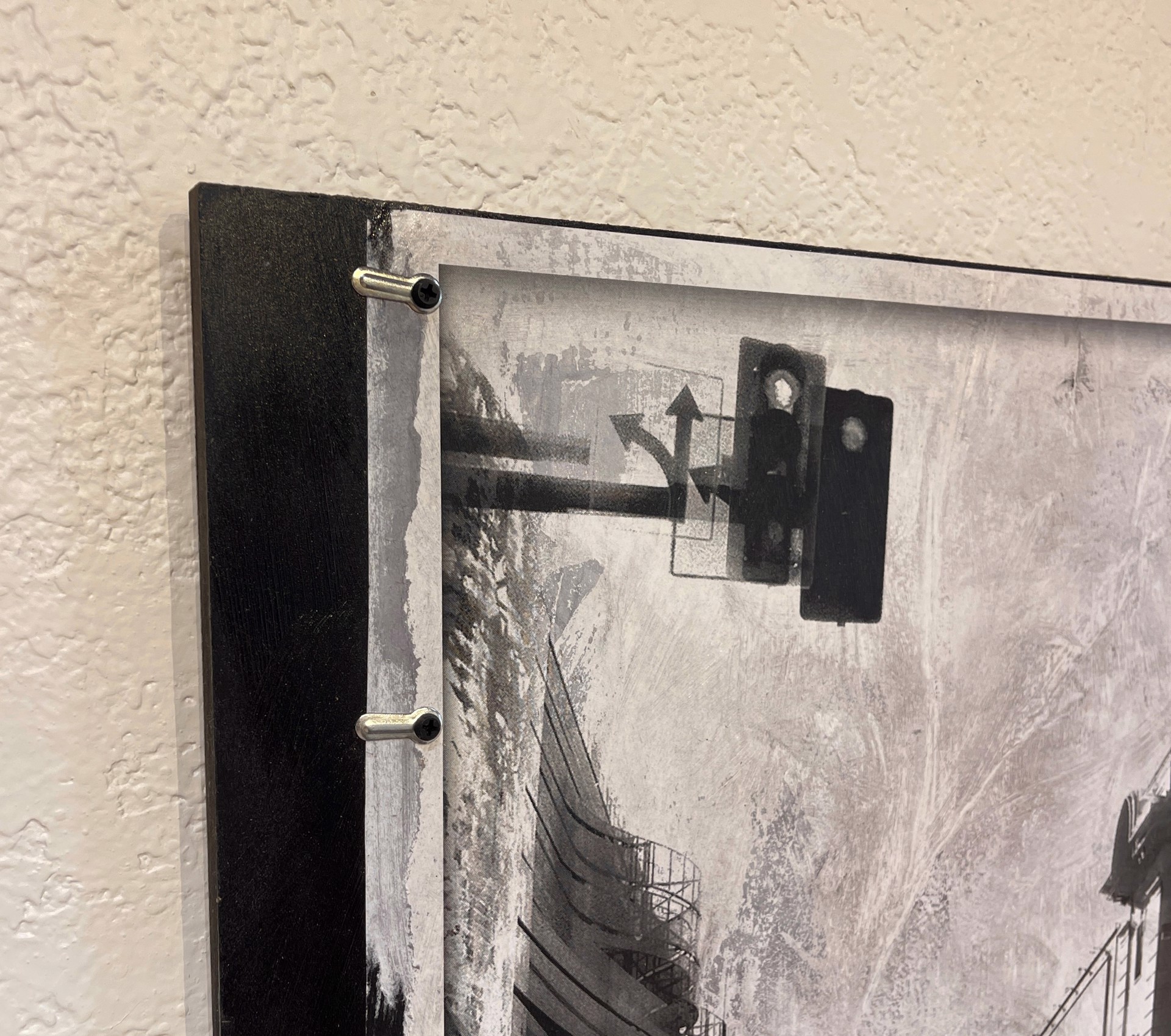 A black and white photo of a city street.