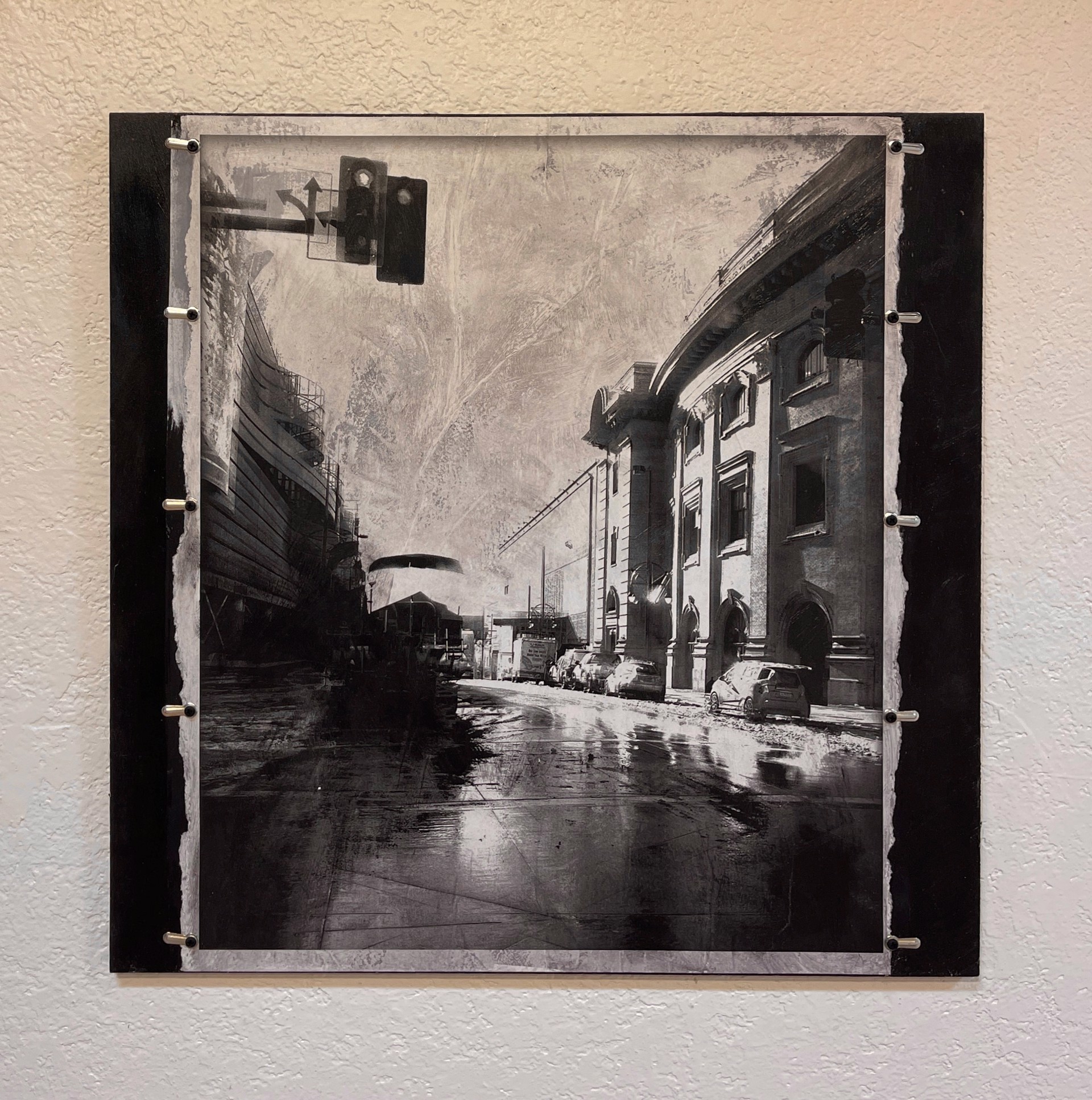 A black and white photo of a city street.