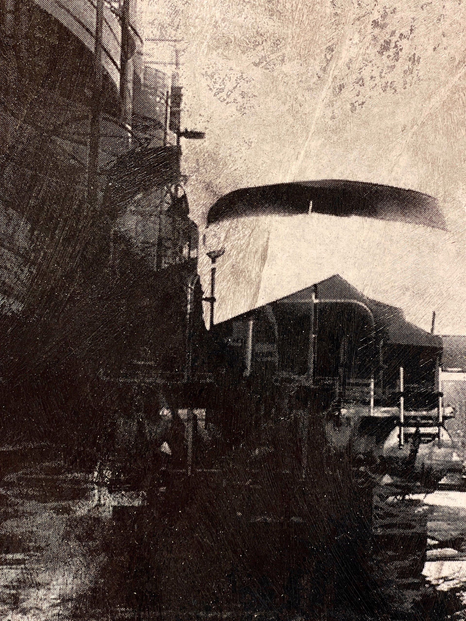 A black and white photo of a city street.