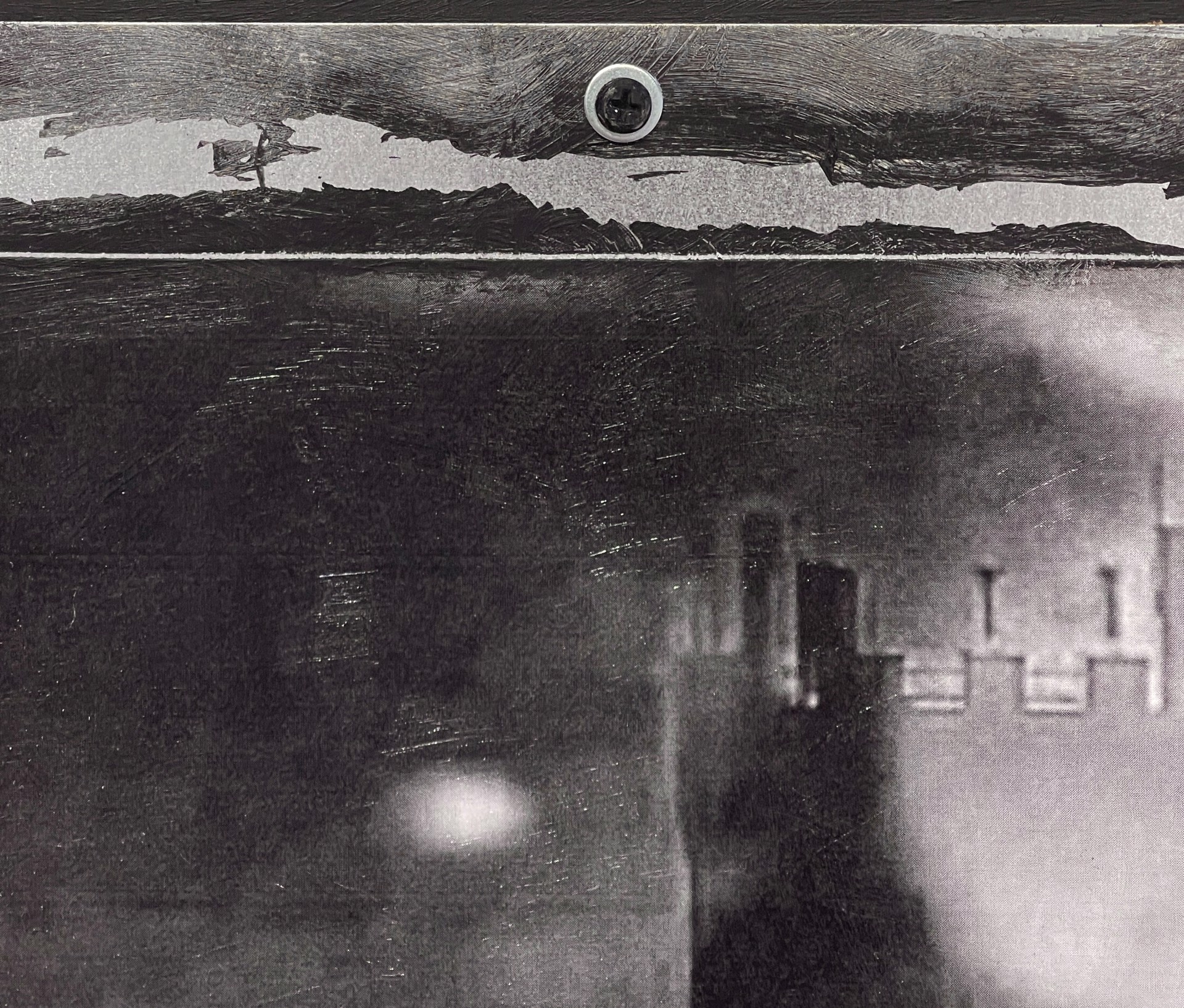 A black and white photo of a person walking down a street.