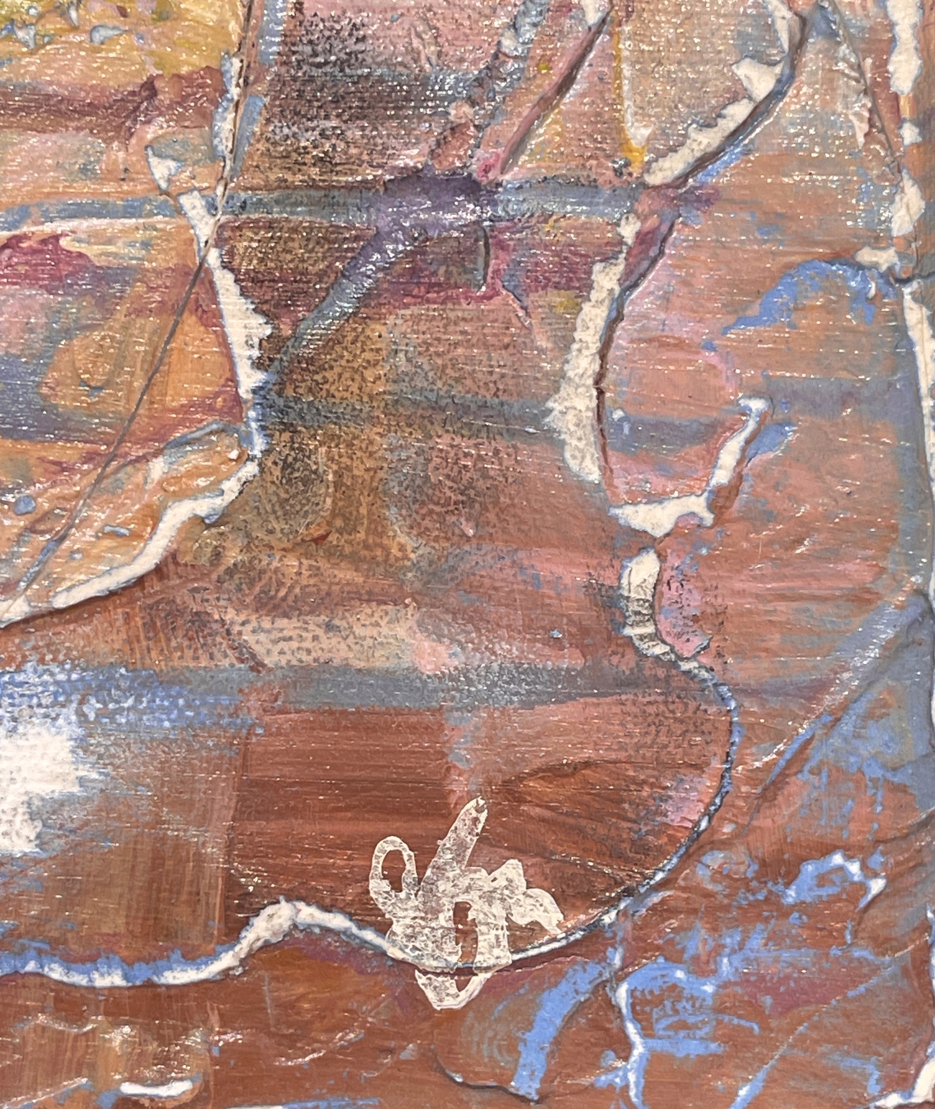 A painting of a face on a piece of paper.