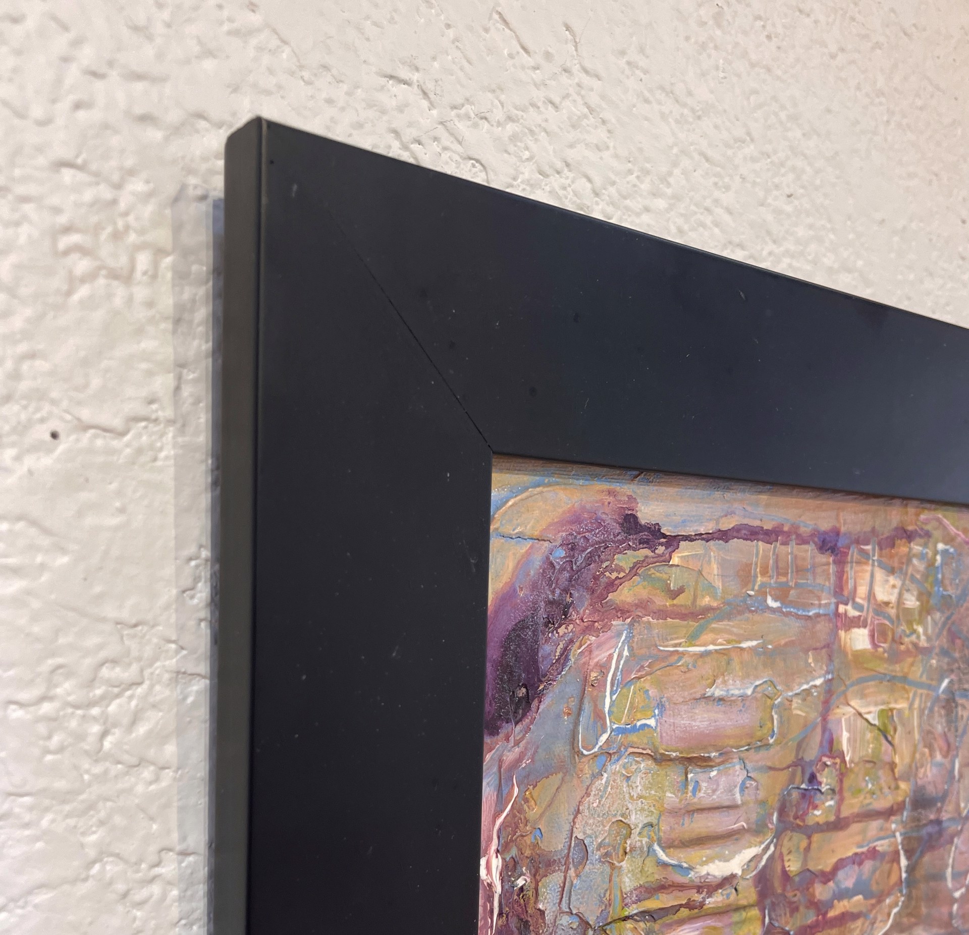 A painting of a face on a piece of paper.