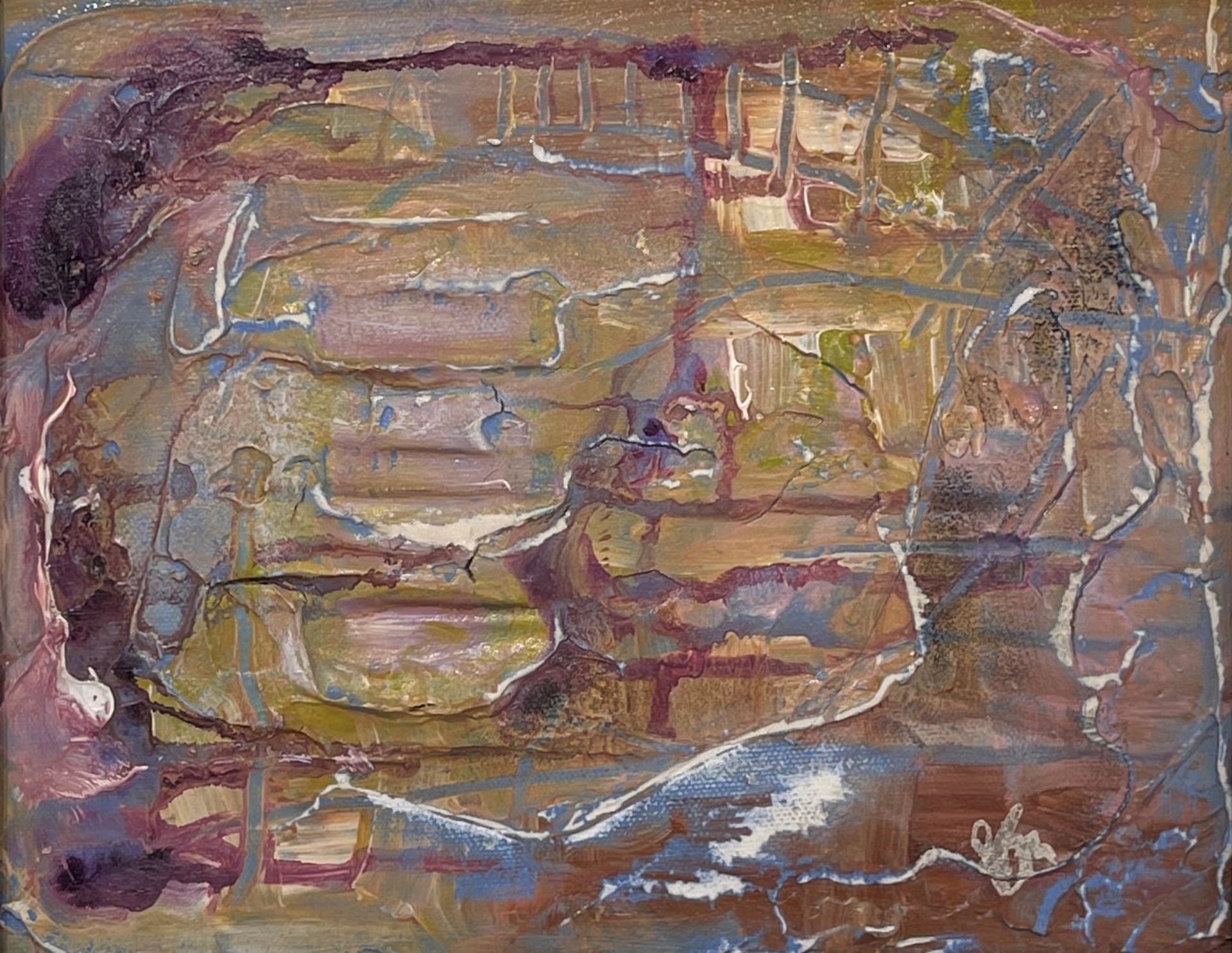 A painting of a face on a piece of paper.