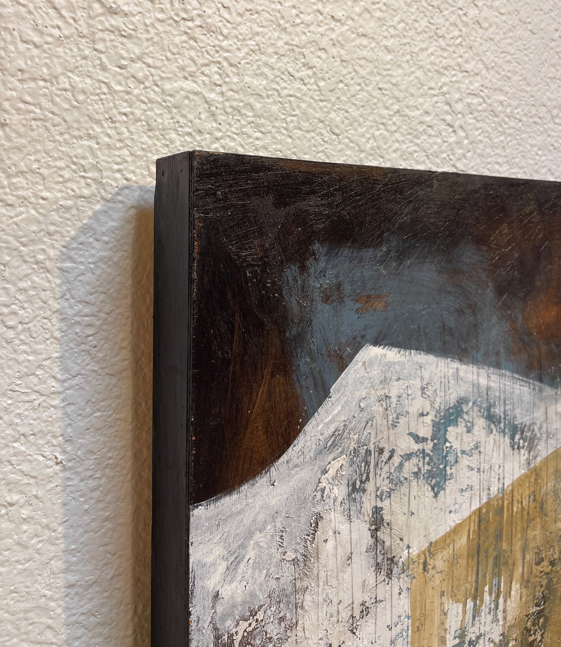 A painting of a man standing in front of a waterfall.