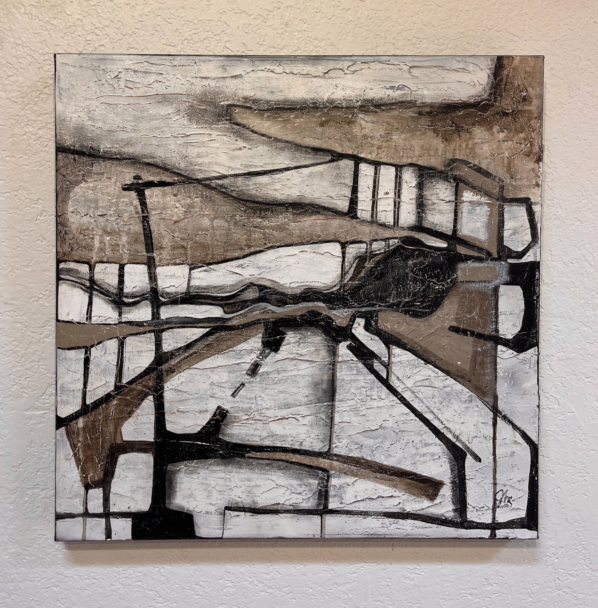 A painting of a black and white abstract painting on a wall.