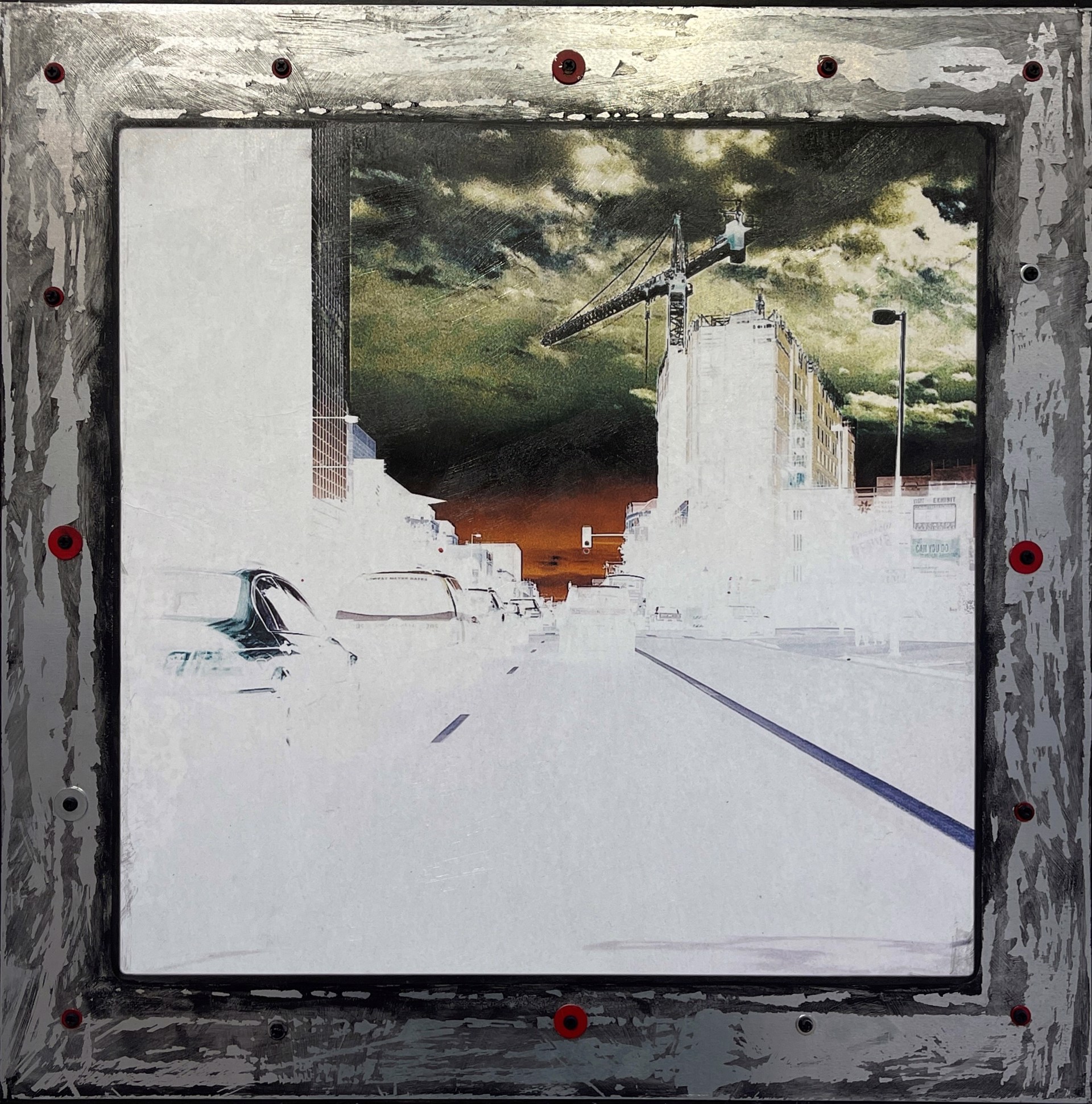 A picture of a city street with a crane in the background.