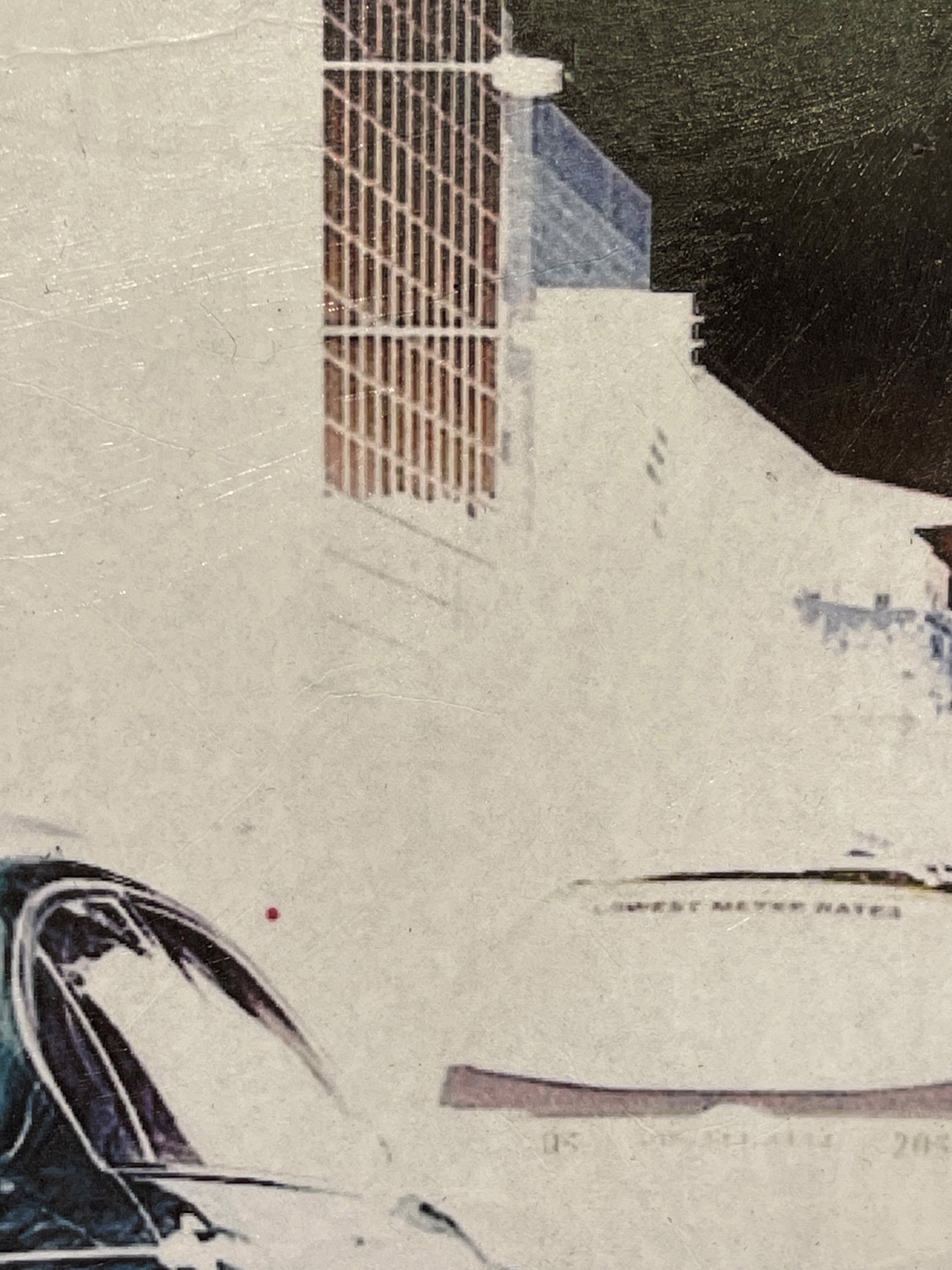 A picture of a city street with a crane in the background.