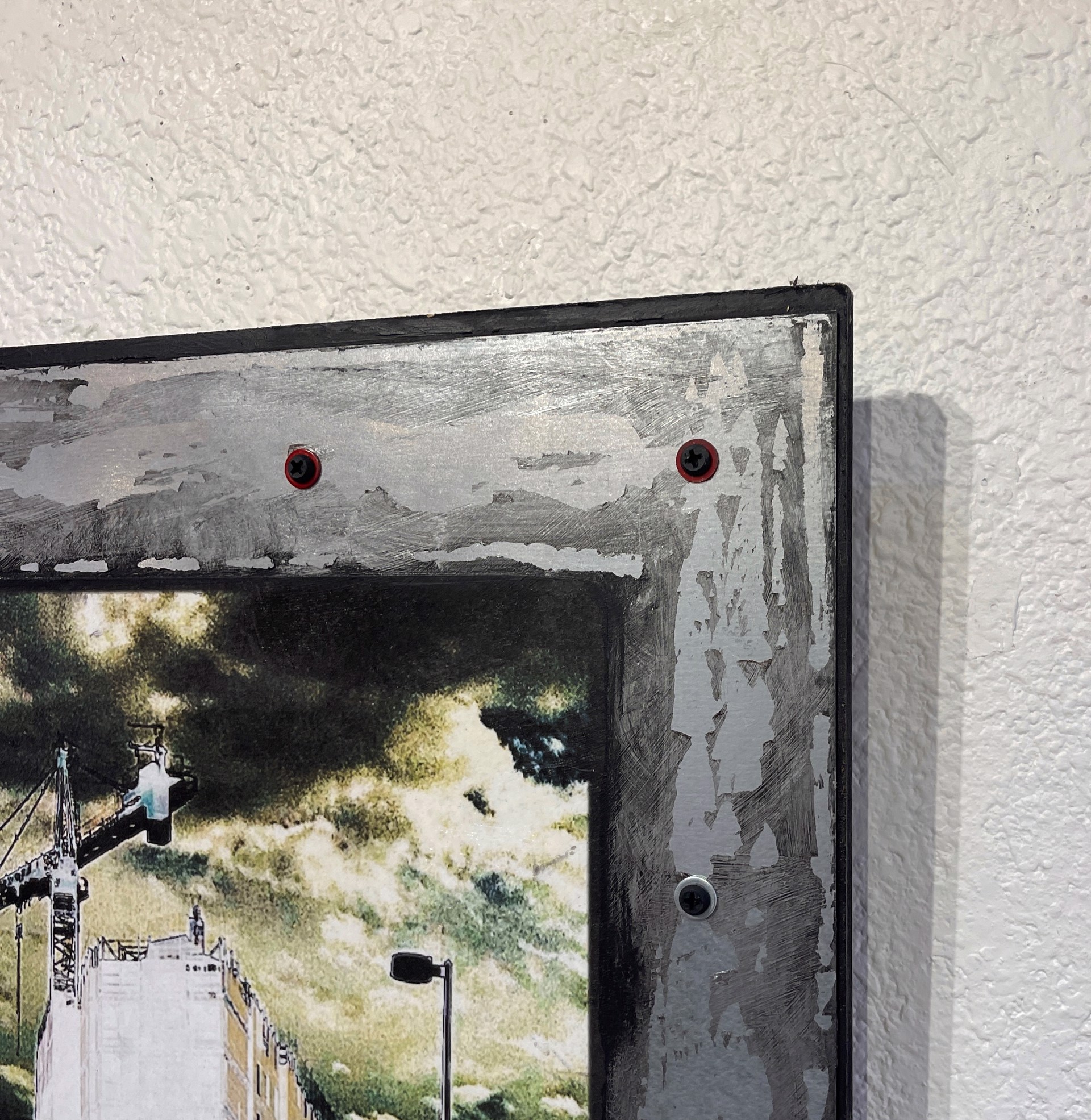 A picture of a city street with a crane in the background.