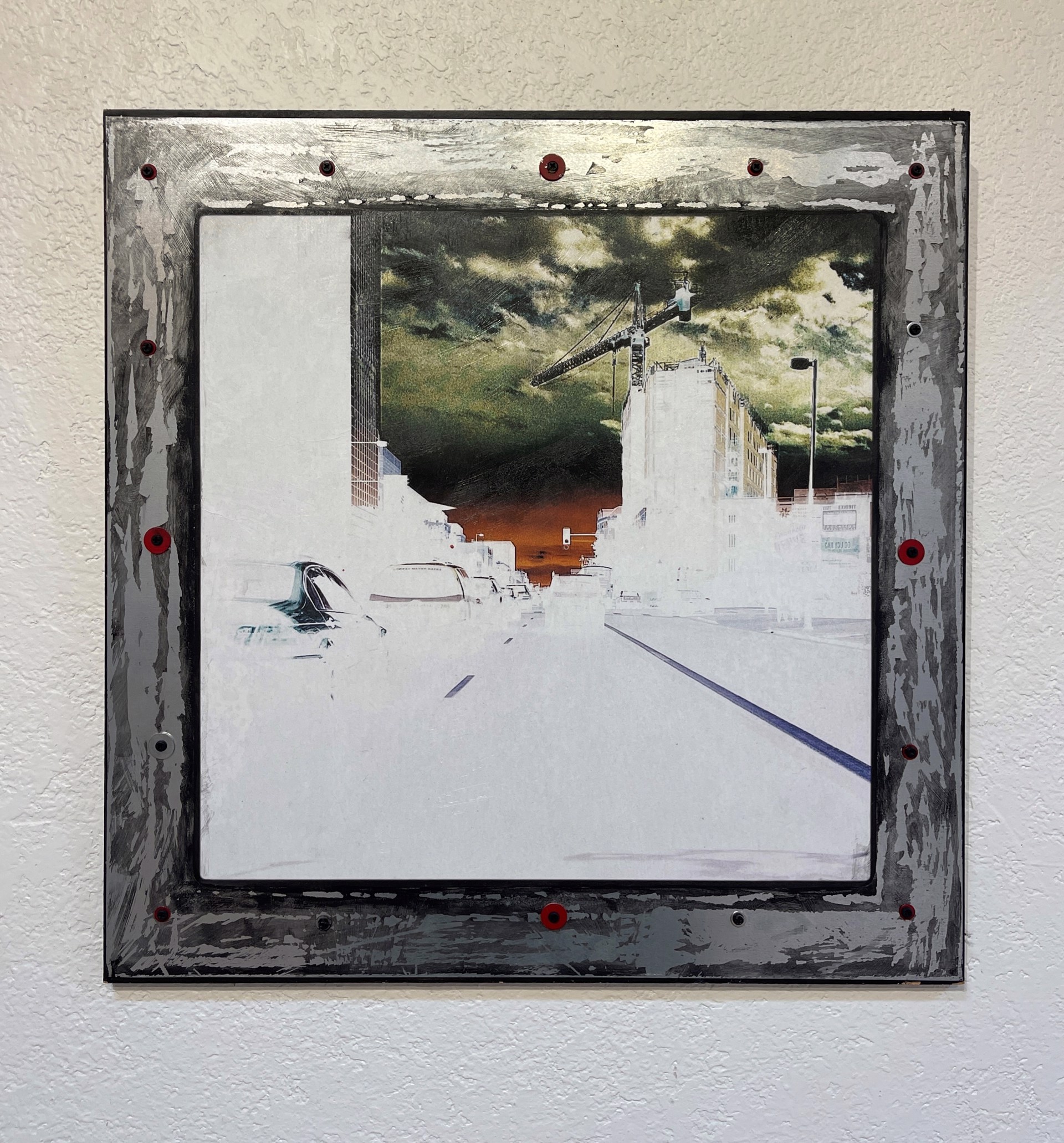 A picture of a city street with a crane in the background.