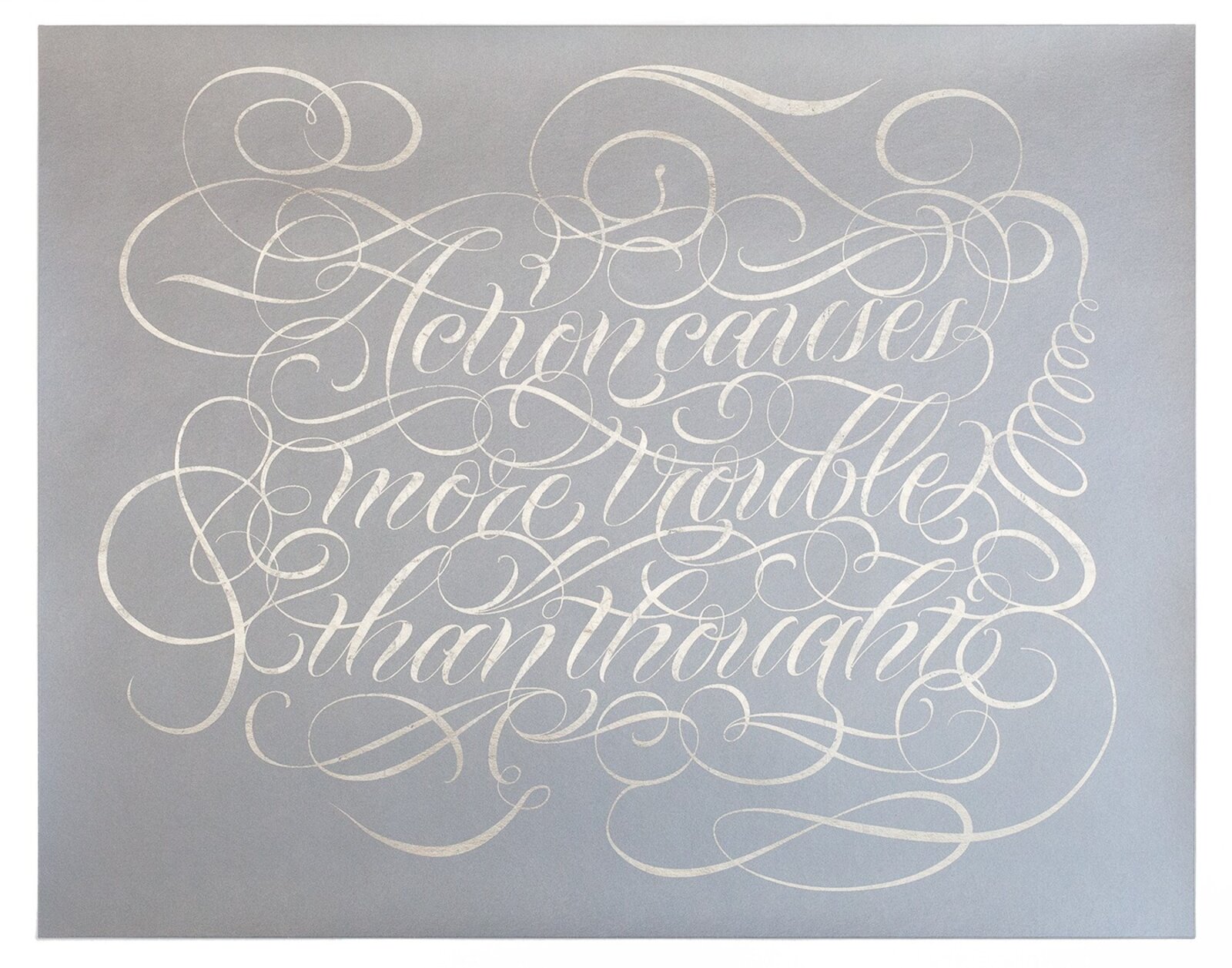 A silver metallic print of ornate calligraphy on a matte grey background.