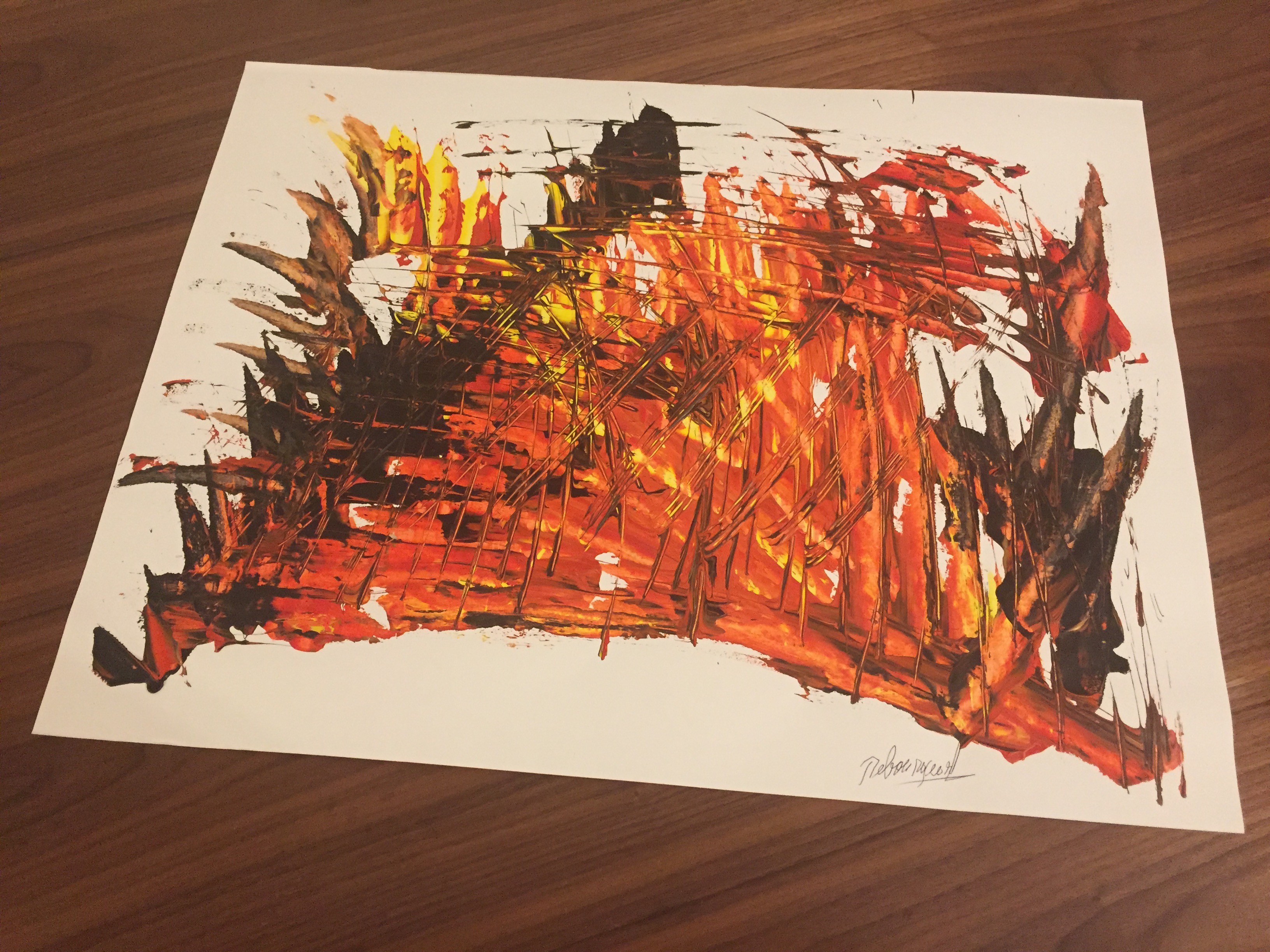 A painting on a wooden table with a white background.