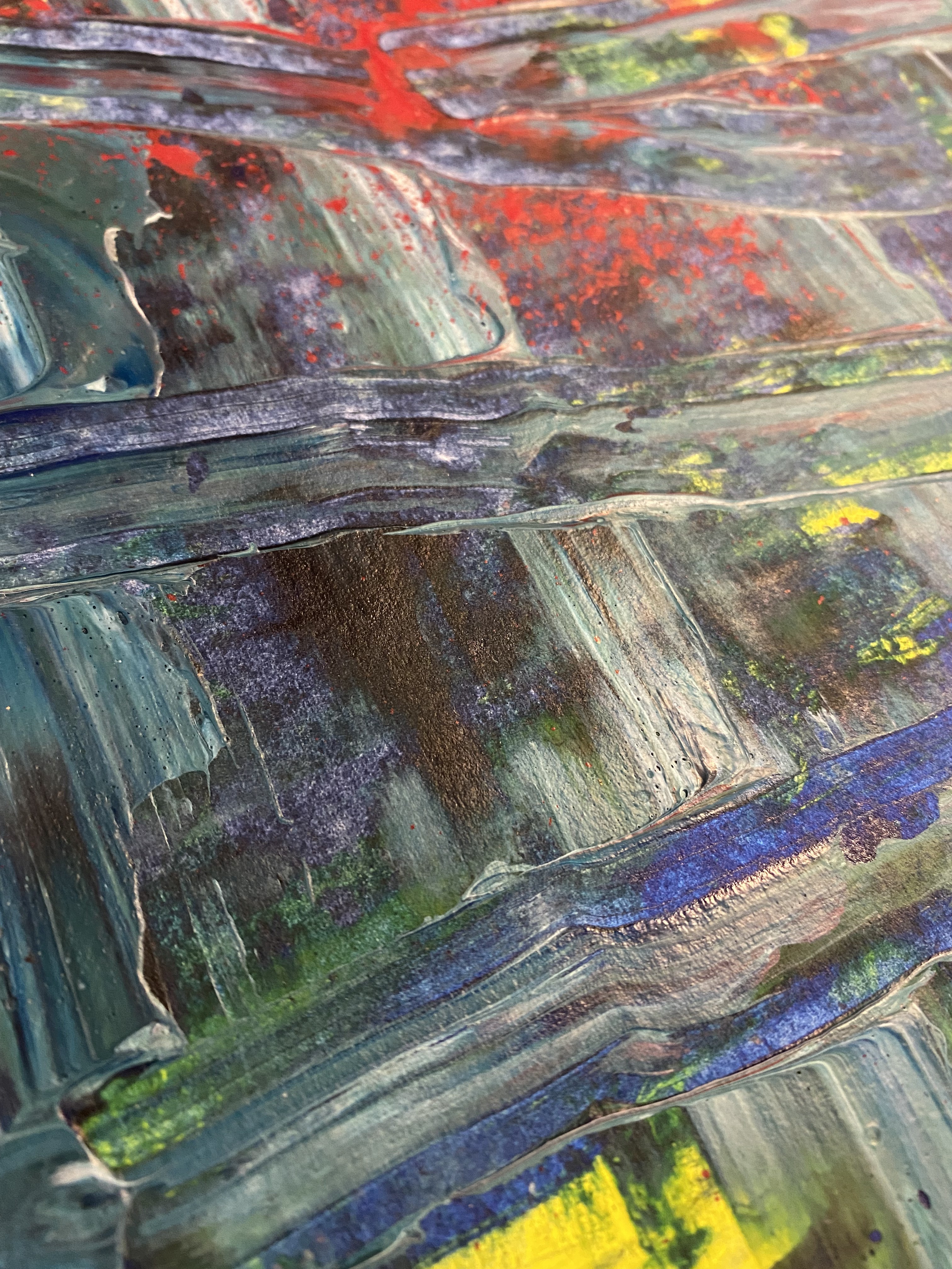 A painting on a piece of paper on a table.