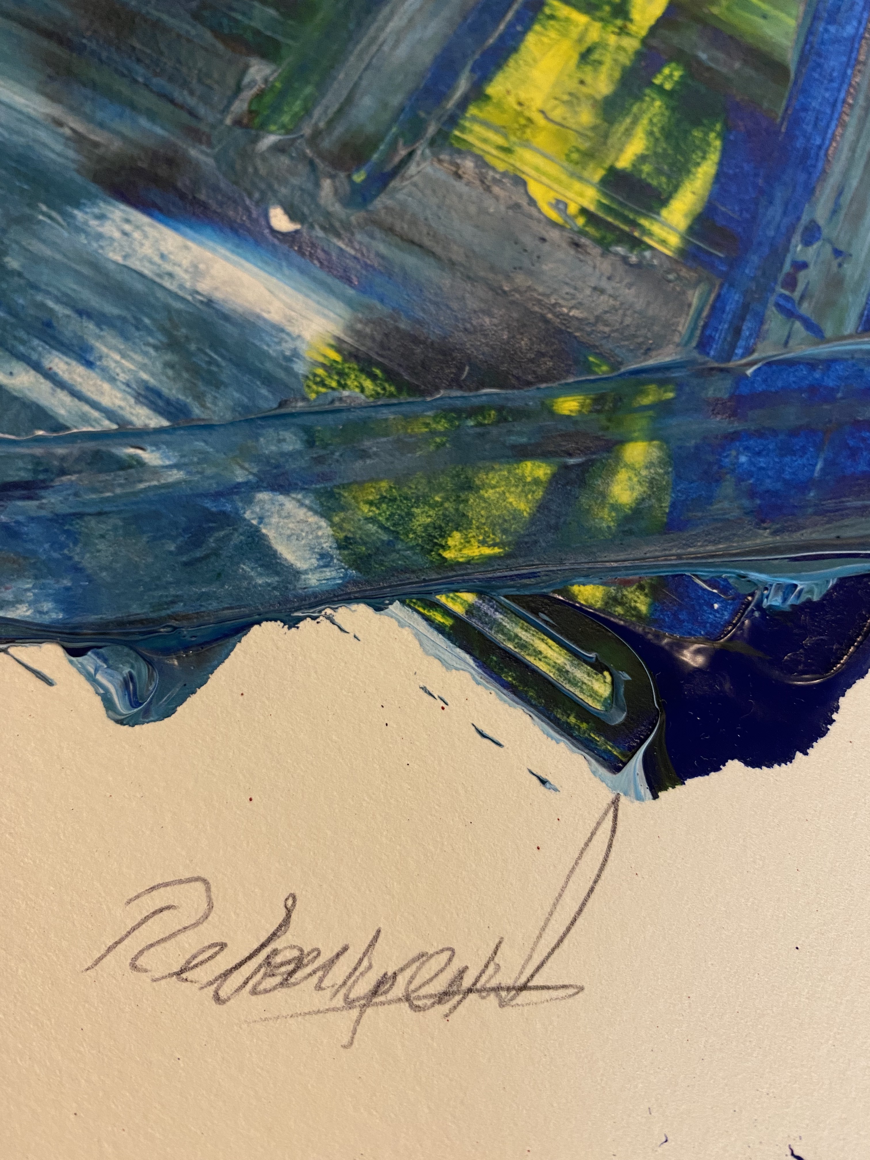 A painting on a piece of paper on a table.