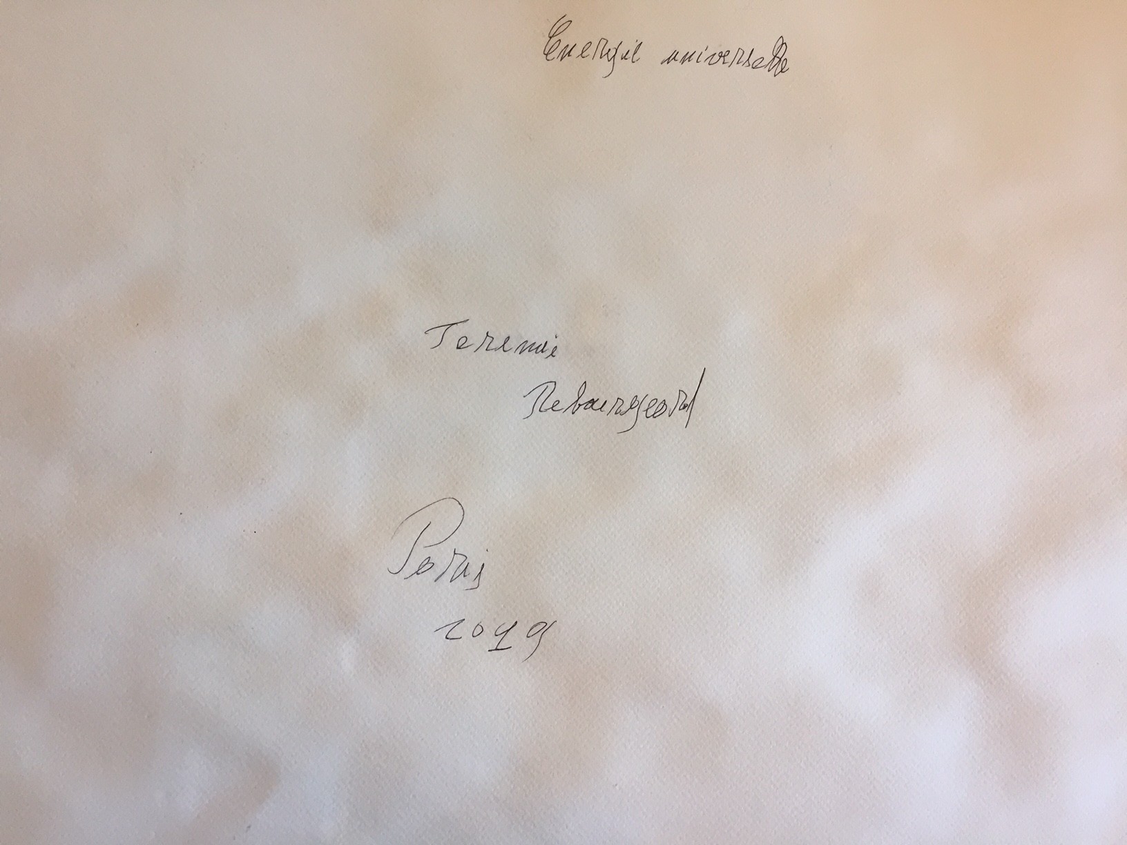A painting on a piece of paper on a table.