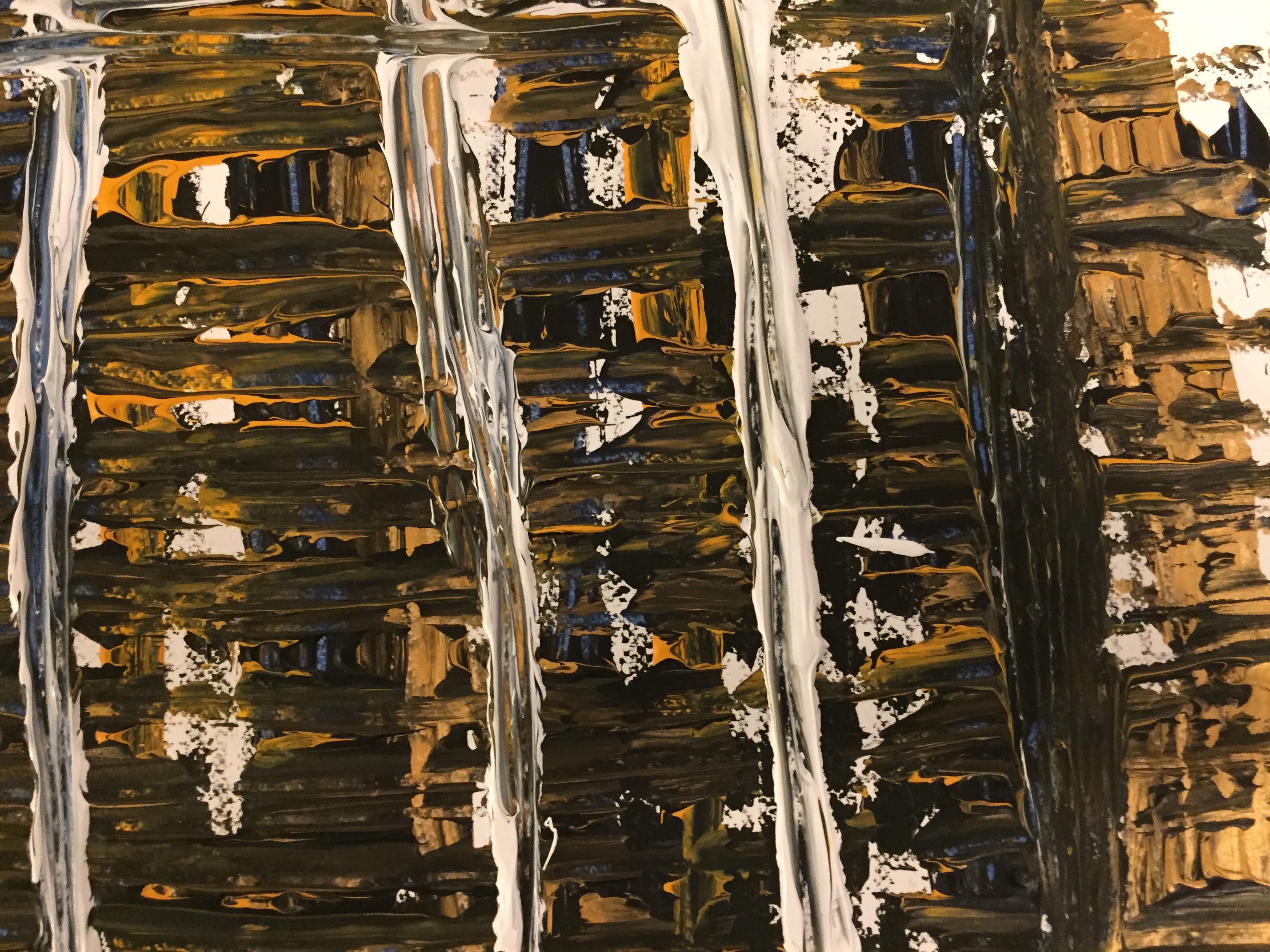 A painting on a piece of paper on a table.