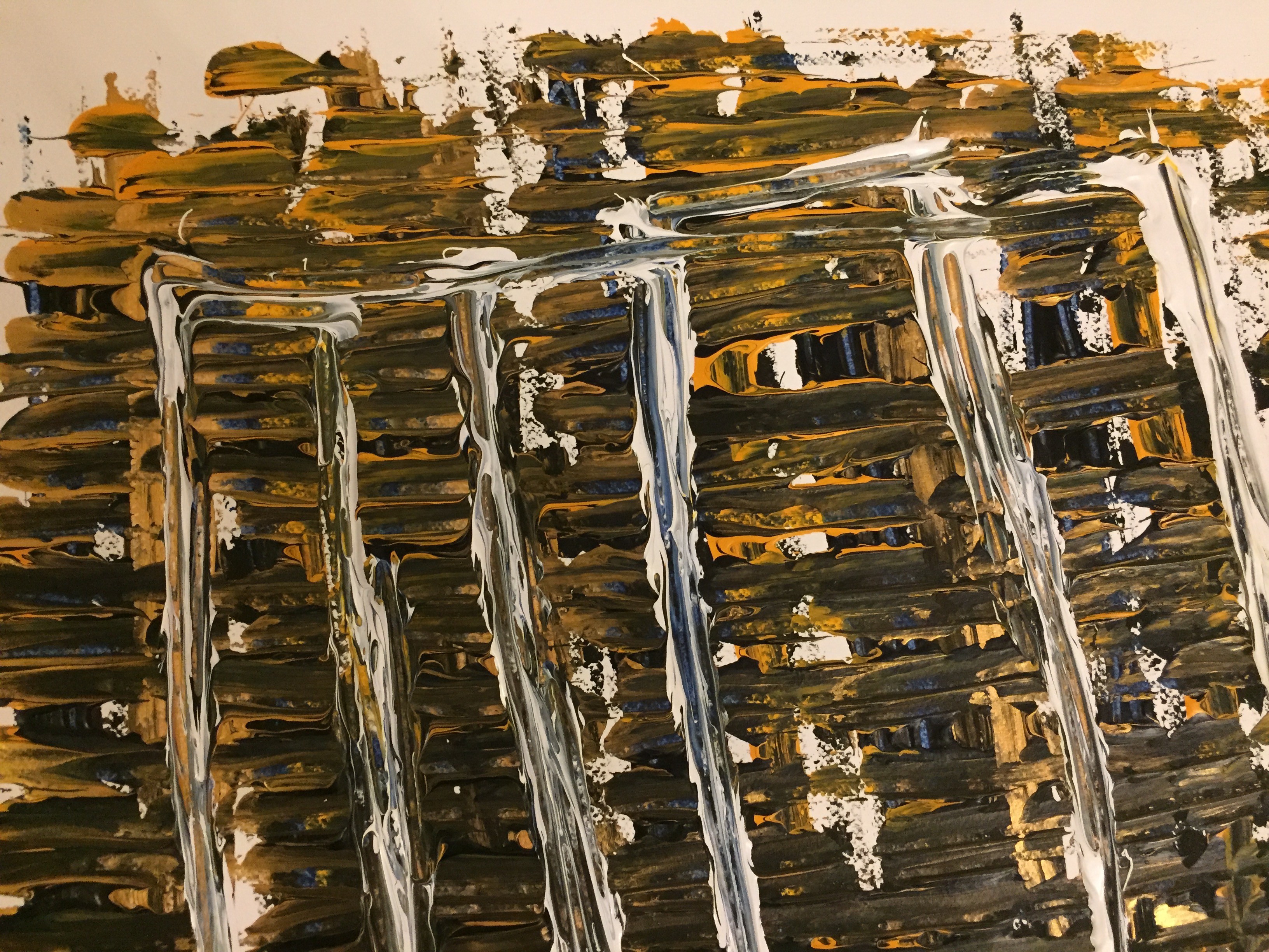 A painting on a piece of paper on a table.