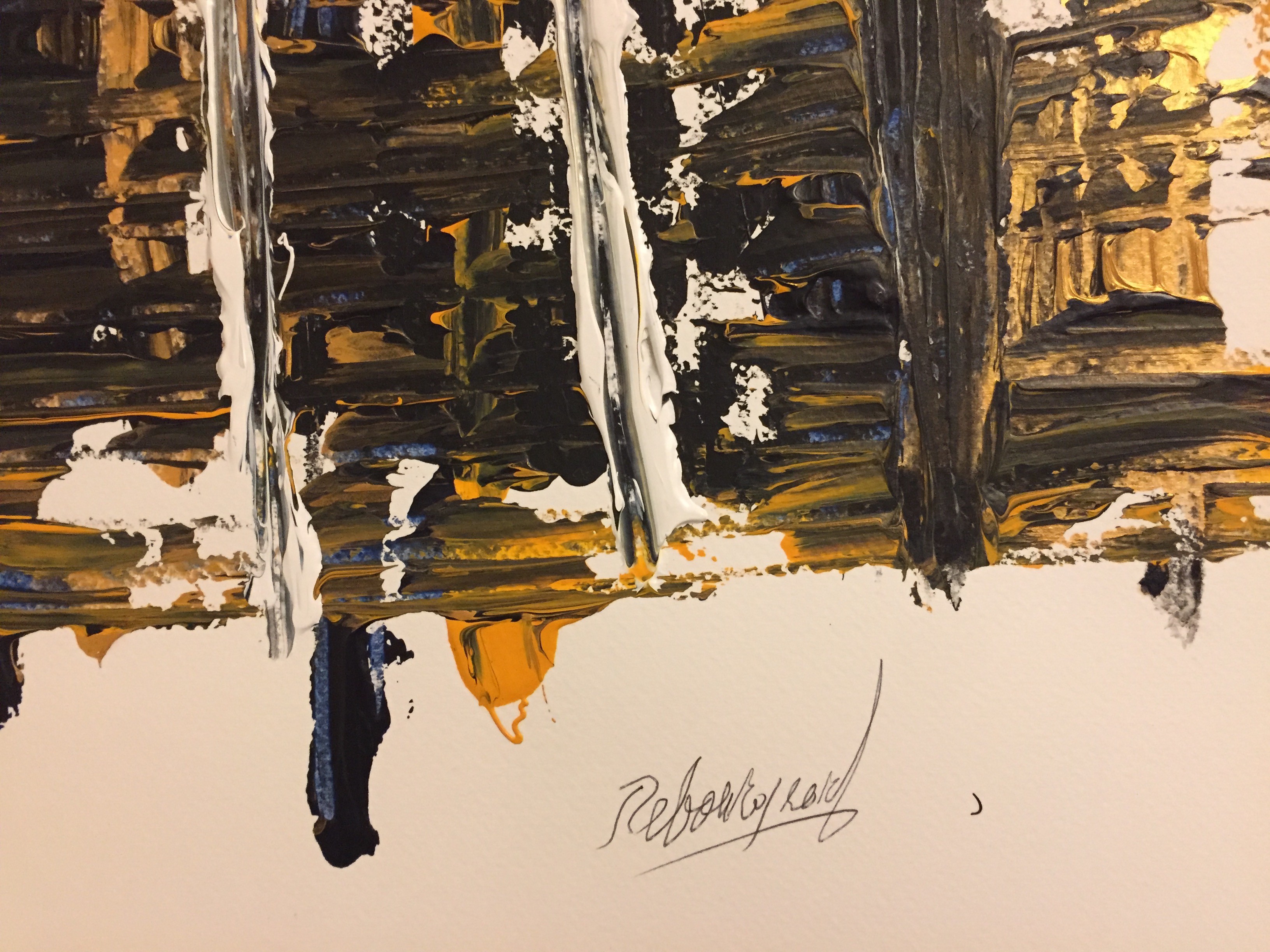 A painting on a piece of paper on a table.