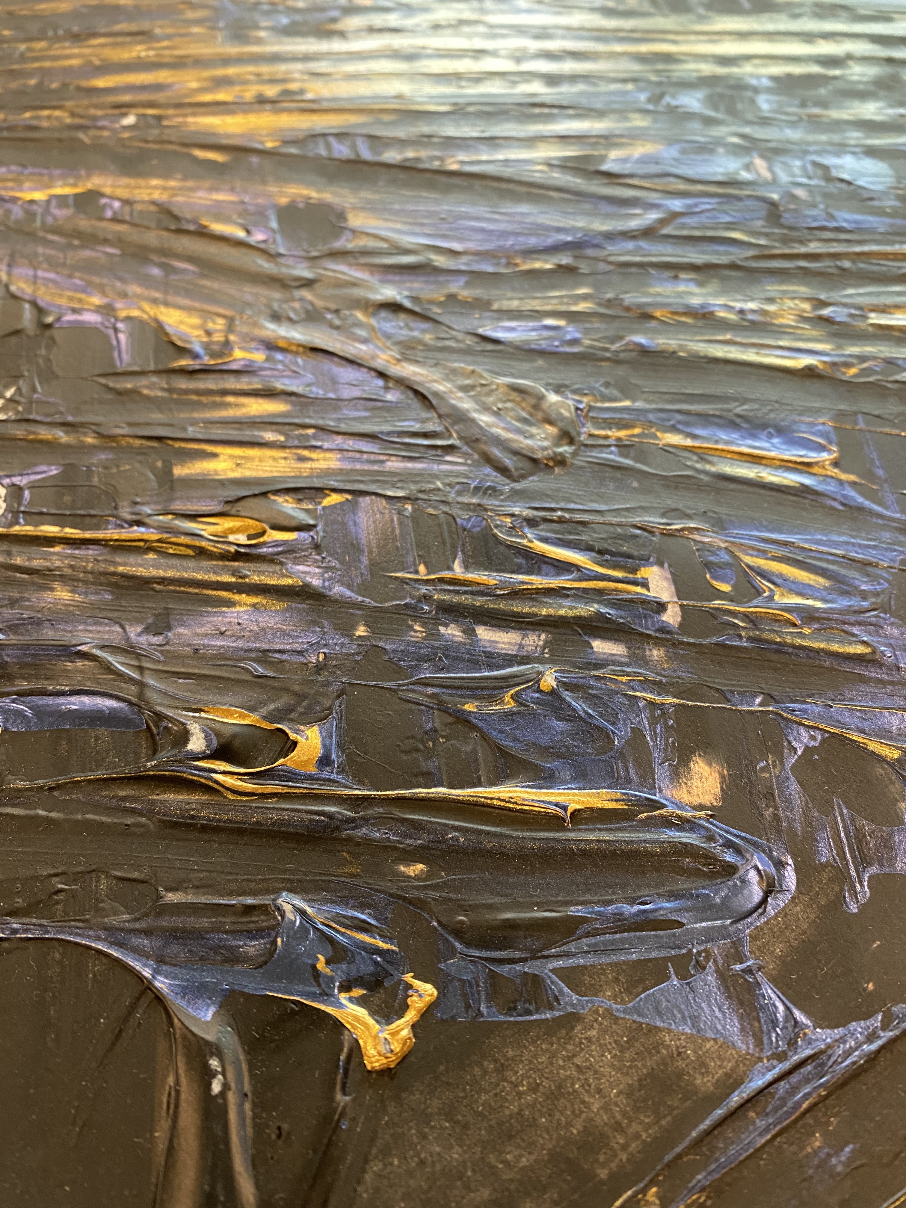 A dynamic abstract expressionist piece featuring bold, layered brushstrokes in black, blue, and gold on a white canvas.