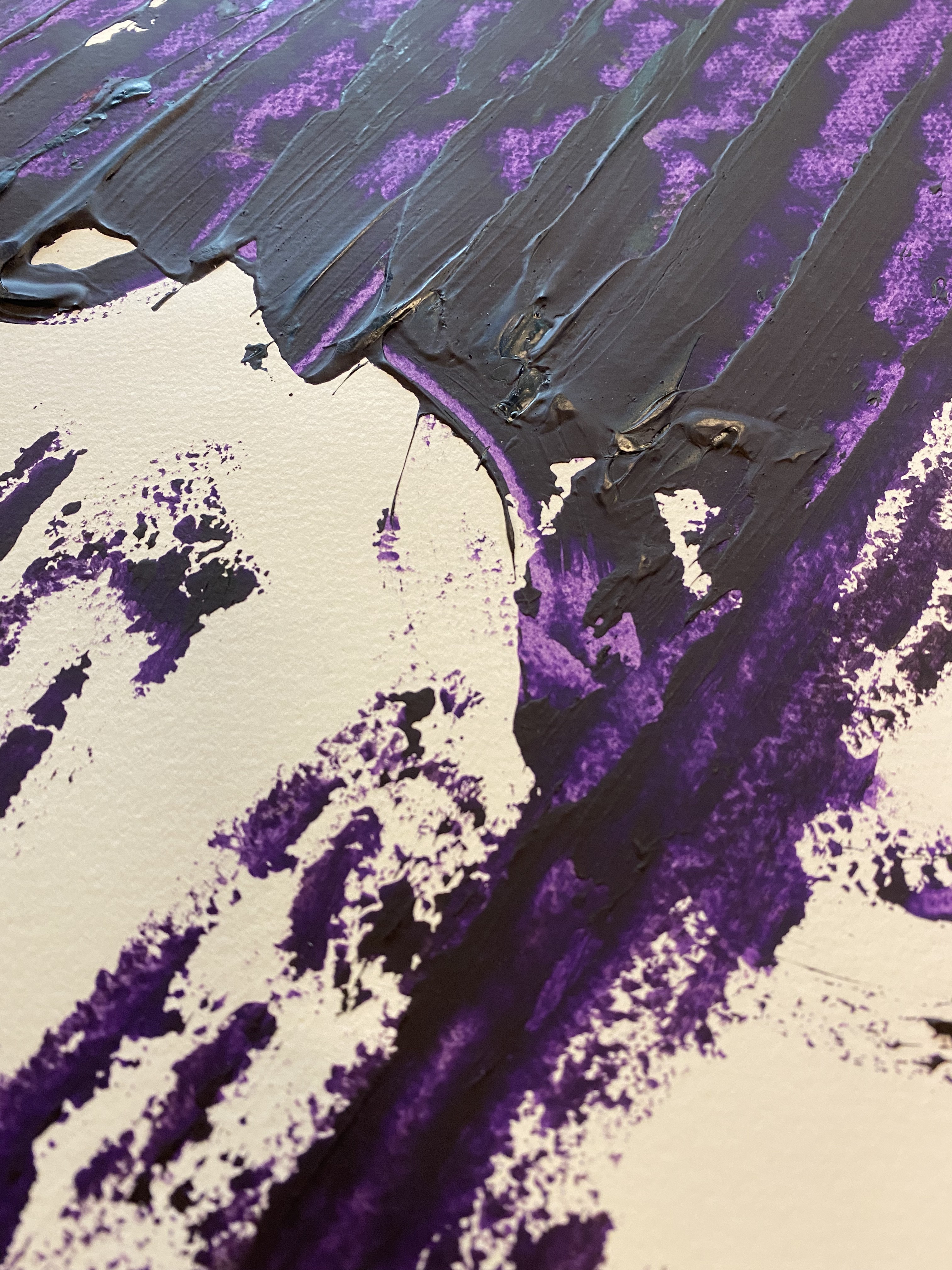 A piece of paper with a purple paint splatter on it.