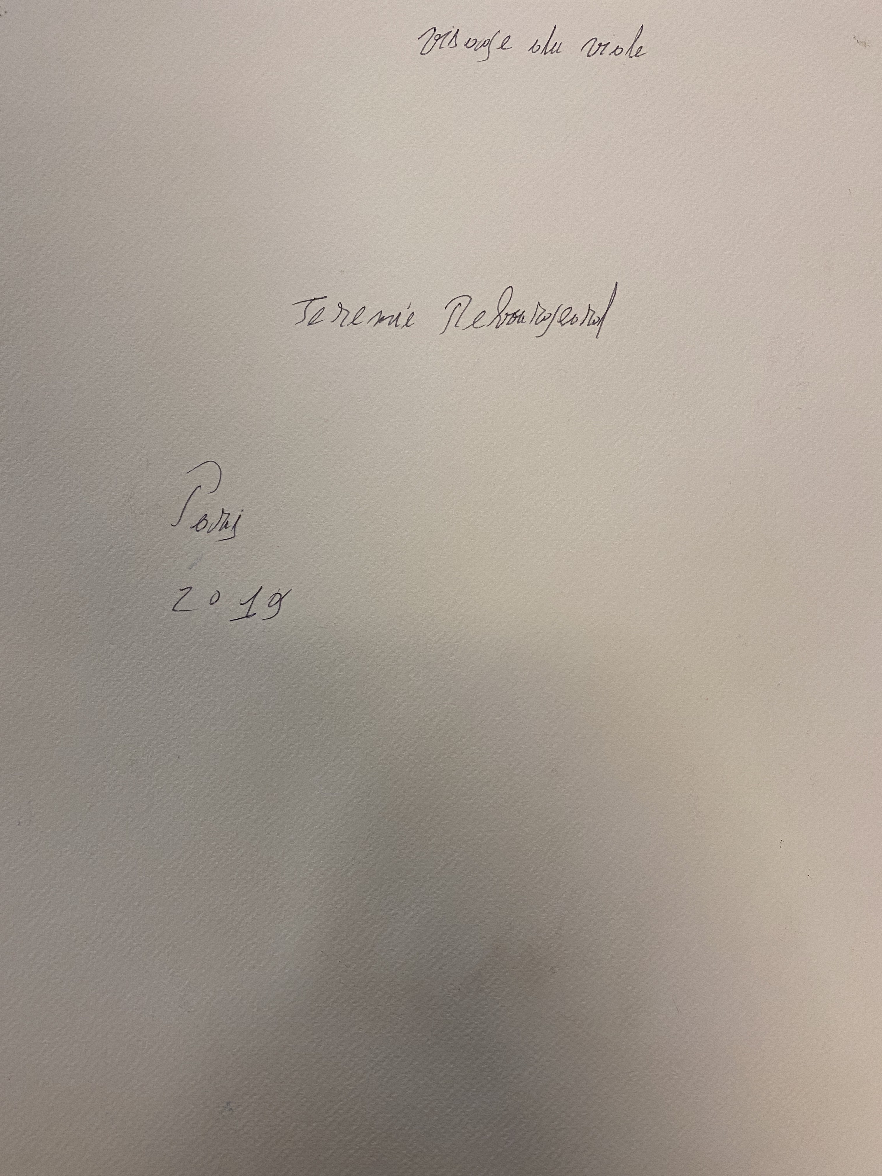 A piece of paper with a purple paint splatter on it.