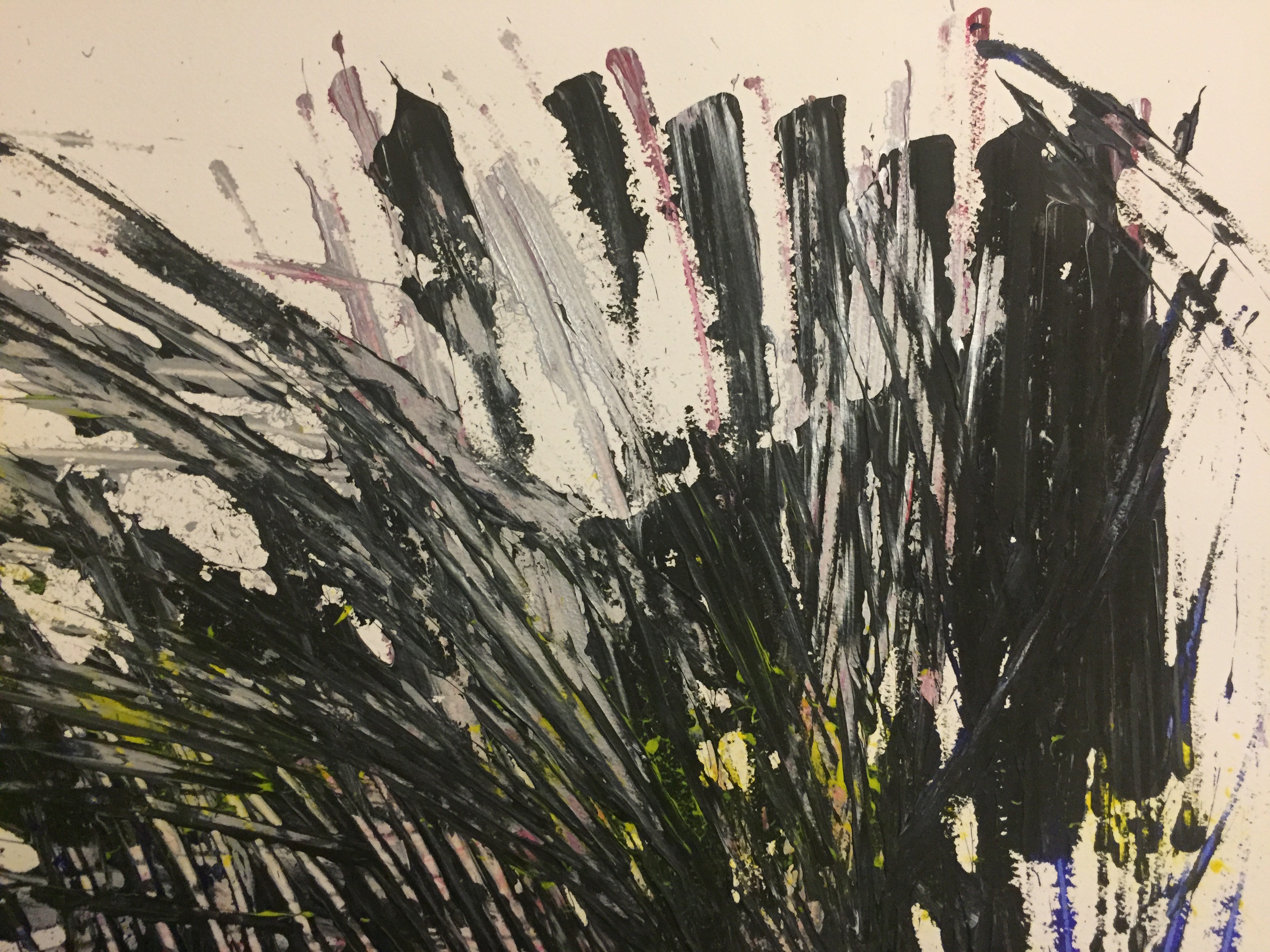 A painting on a wooden surface with black and yellow paint.